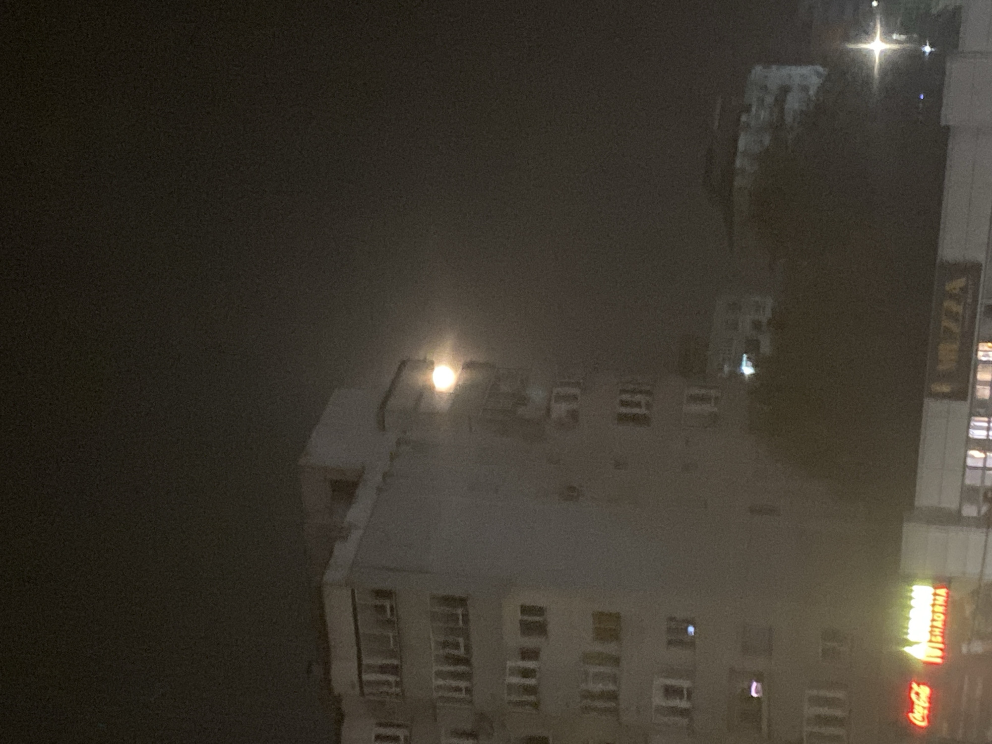 Full moon rises over Iași's Nicolina neighborhood at night