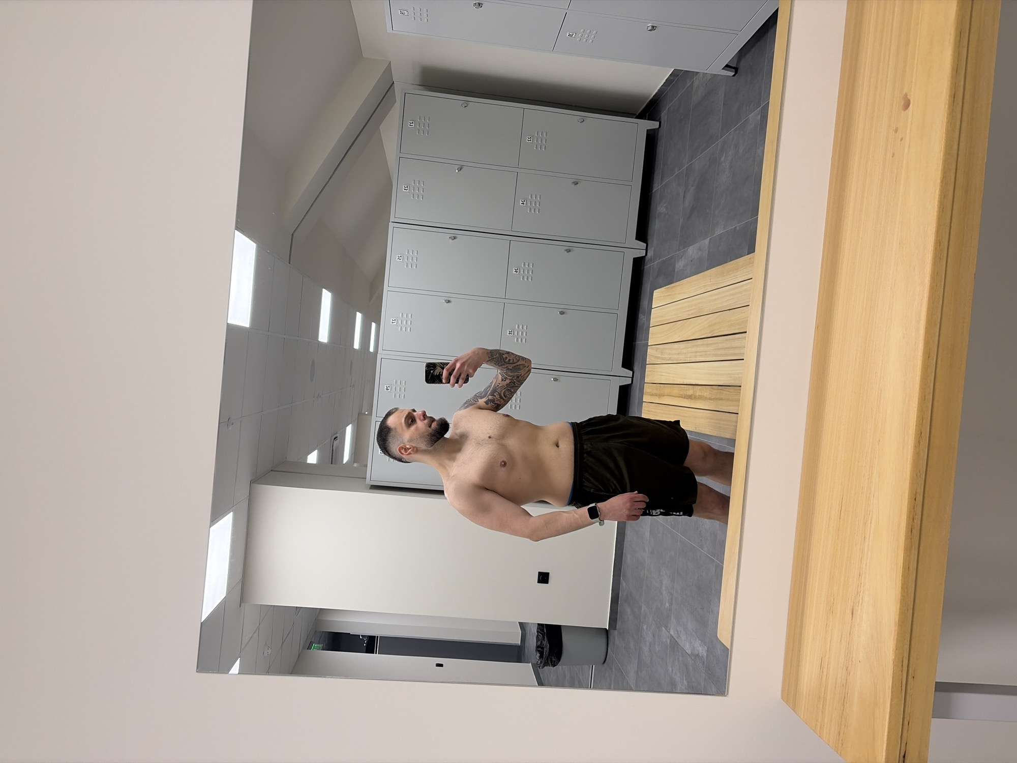 Man takes shirtless selfie in Plovdiv gym locker room