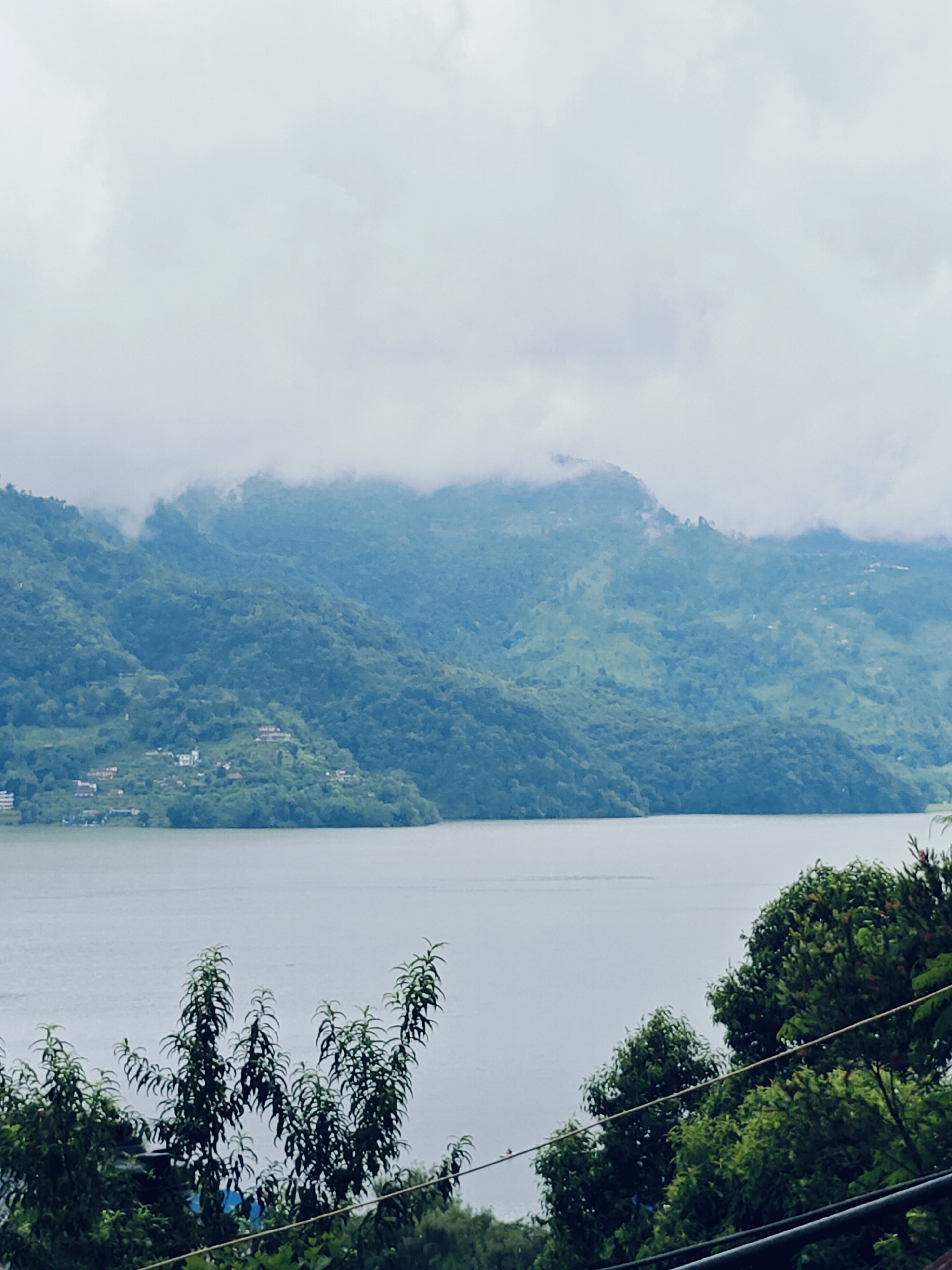 Phewa Lake views and indoor details on a cloudy Pokhara day
