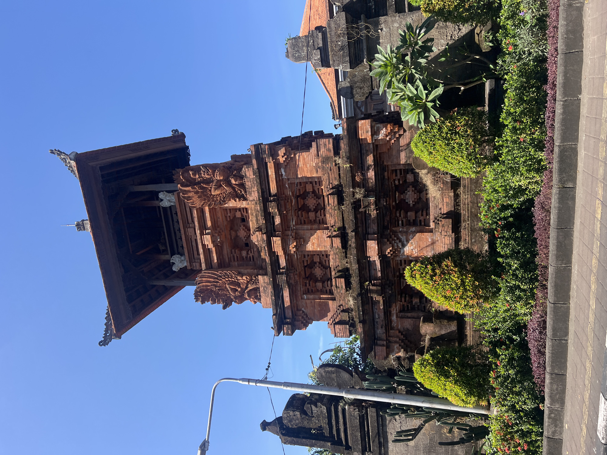 Balinese temple gate and bougainvillea in Denpasar