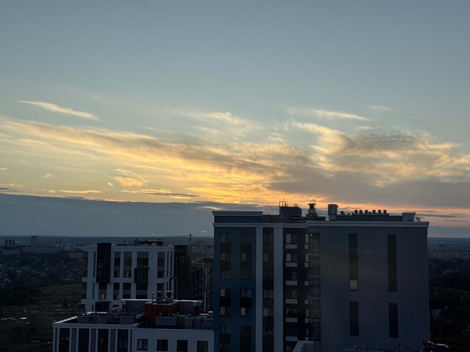 Perm at dusk: city rooftops, open skies, and indoor downtime