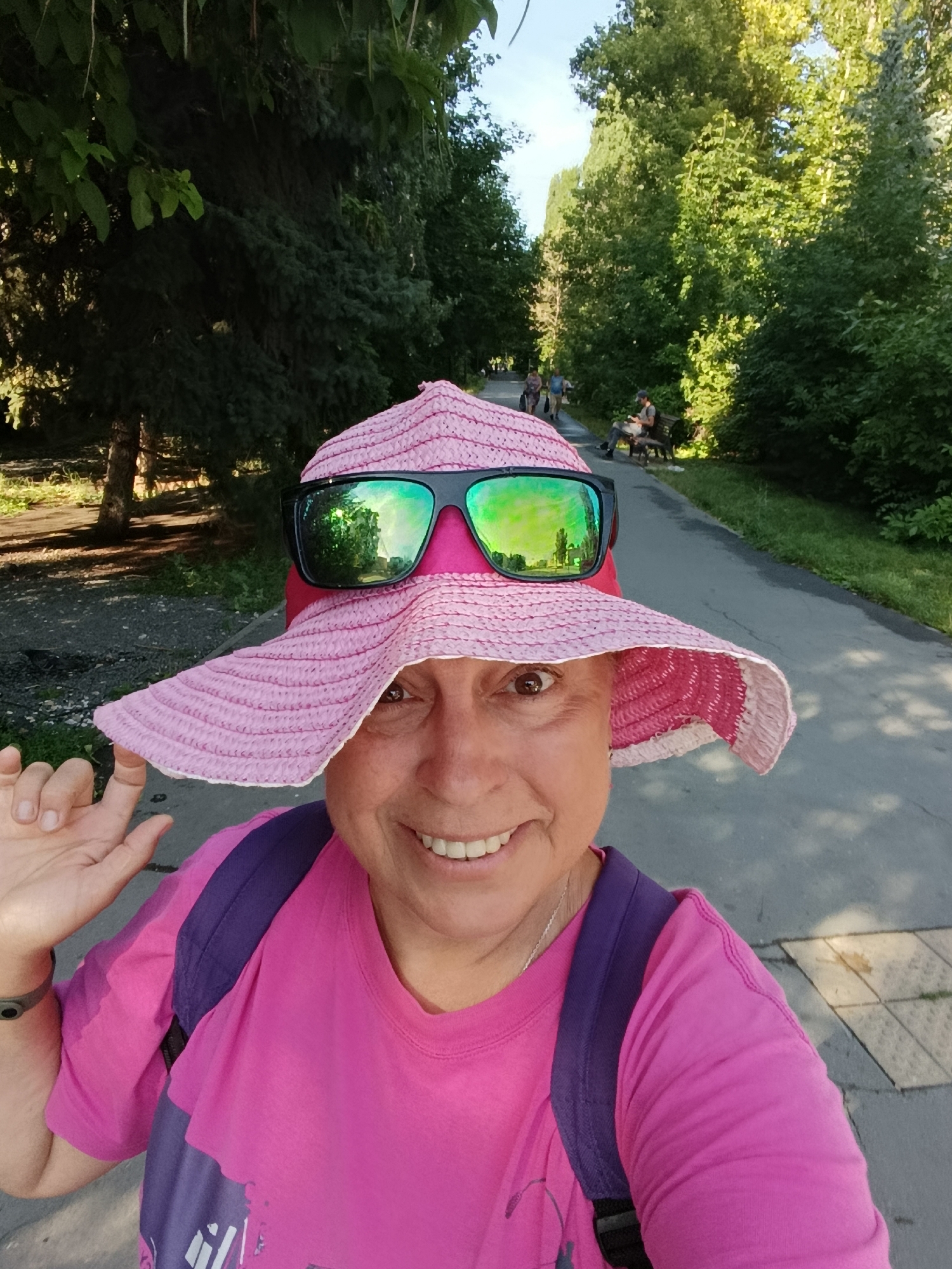 Selfie moment on a shaded park path in Saratov