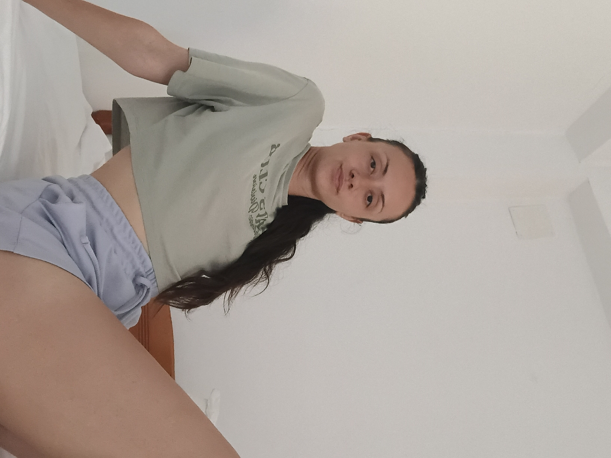 Young woman photographed in multiple indoor poses in Vlora