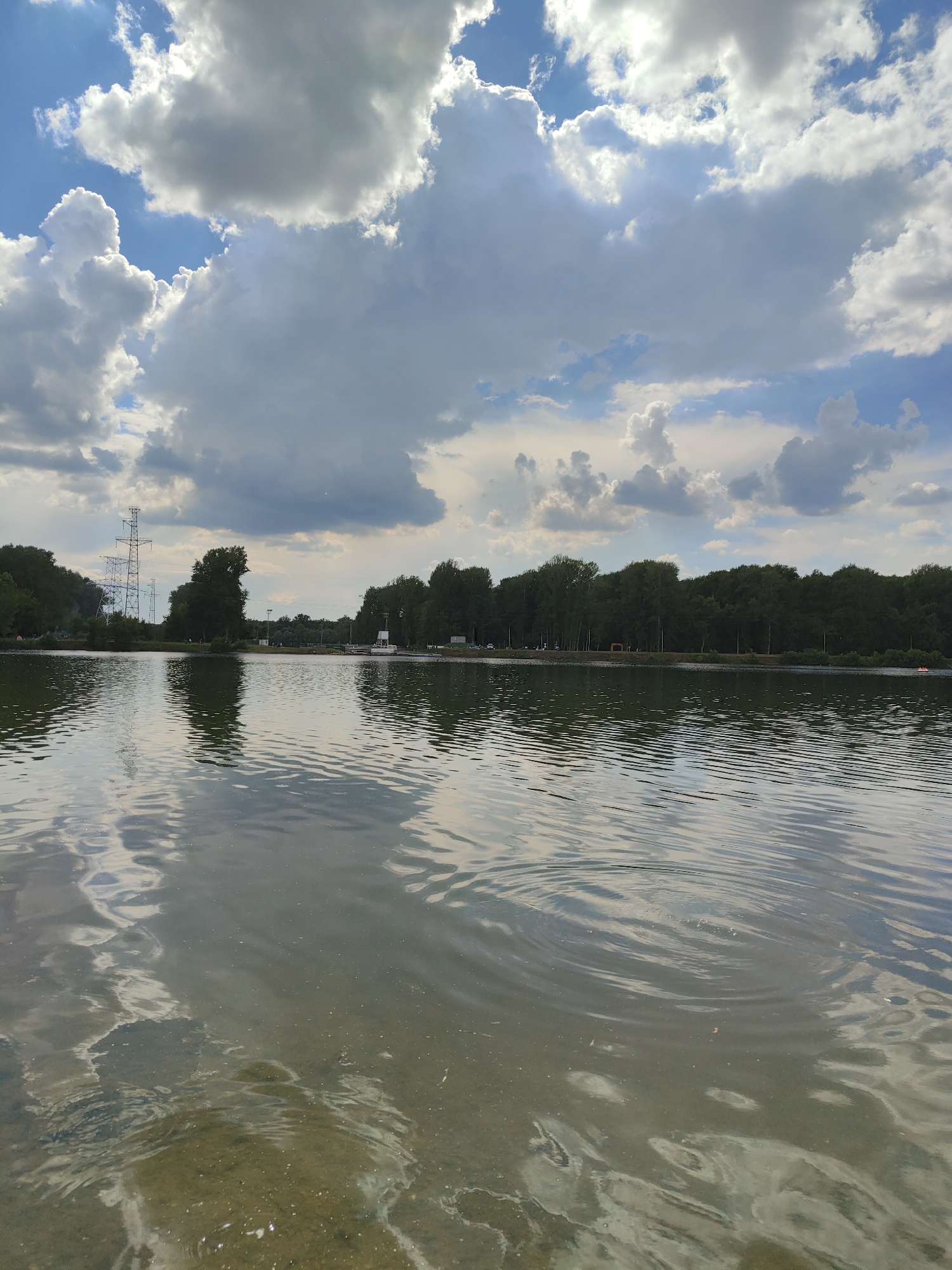 Quiet moments at a lakeside park on cloudy afternoon