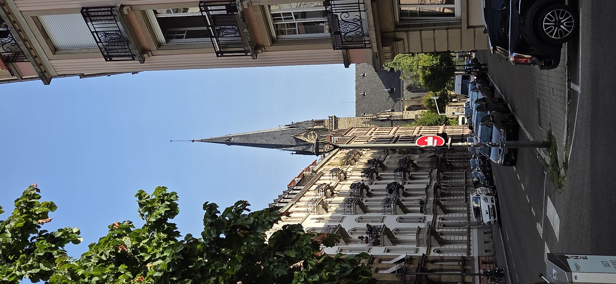 Gothic church, corner hotel, and public sculpture in a compact city center