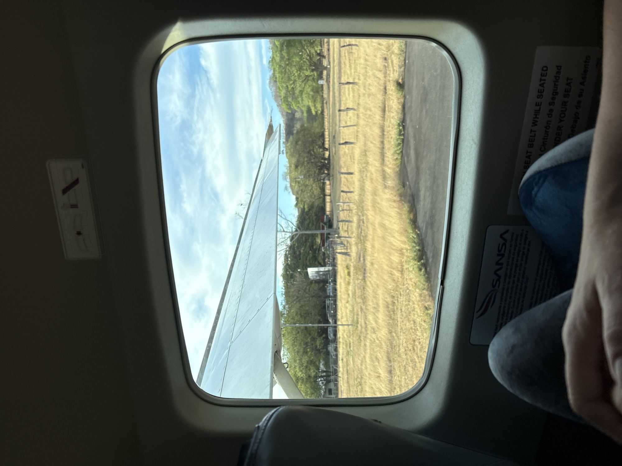 Aircraft passengers document airport views in Costa Rica