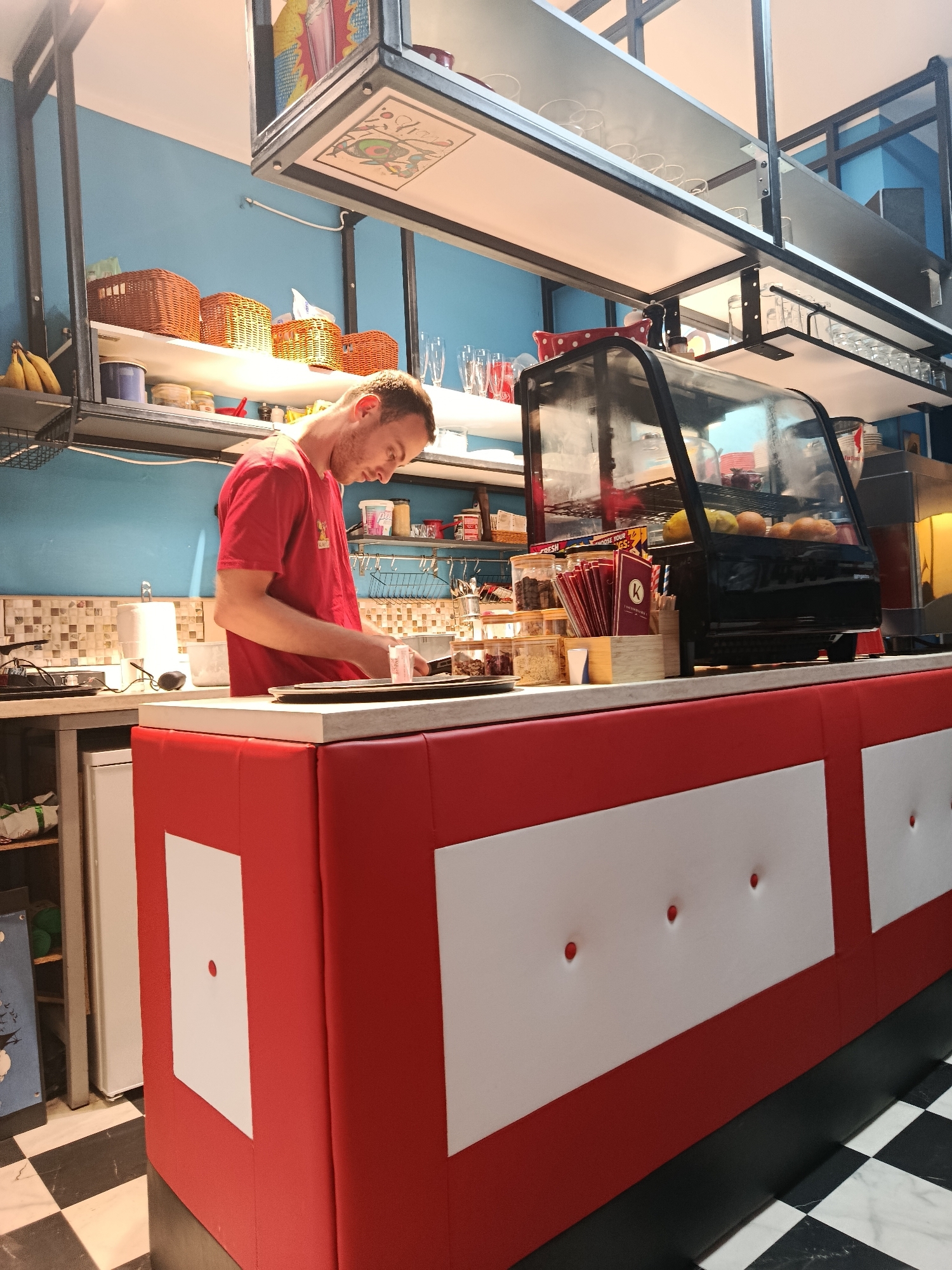 Employee works at retro cafe in Herceg Novi, Montenegro