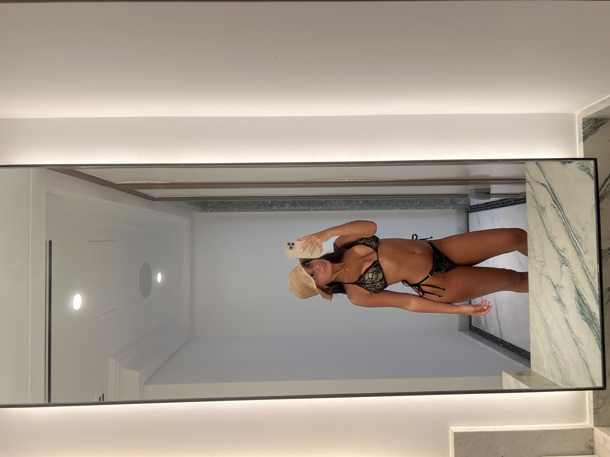 Woman documents Dubai luxury hotel visit with selfies, coconut drink