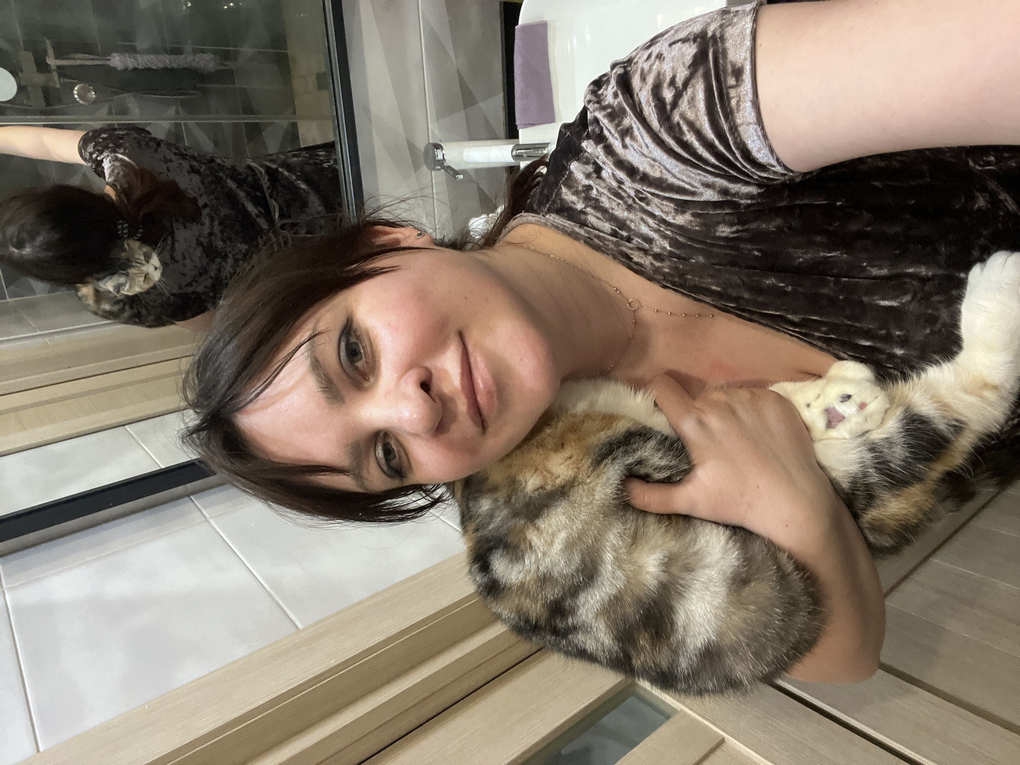 Woman photographed with Scottish Fold cat in Russian home