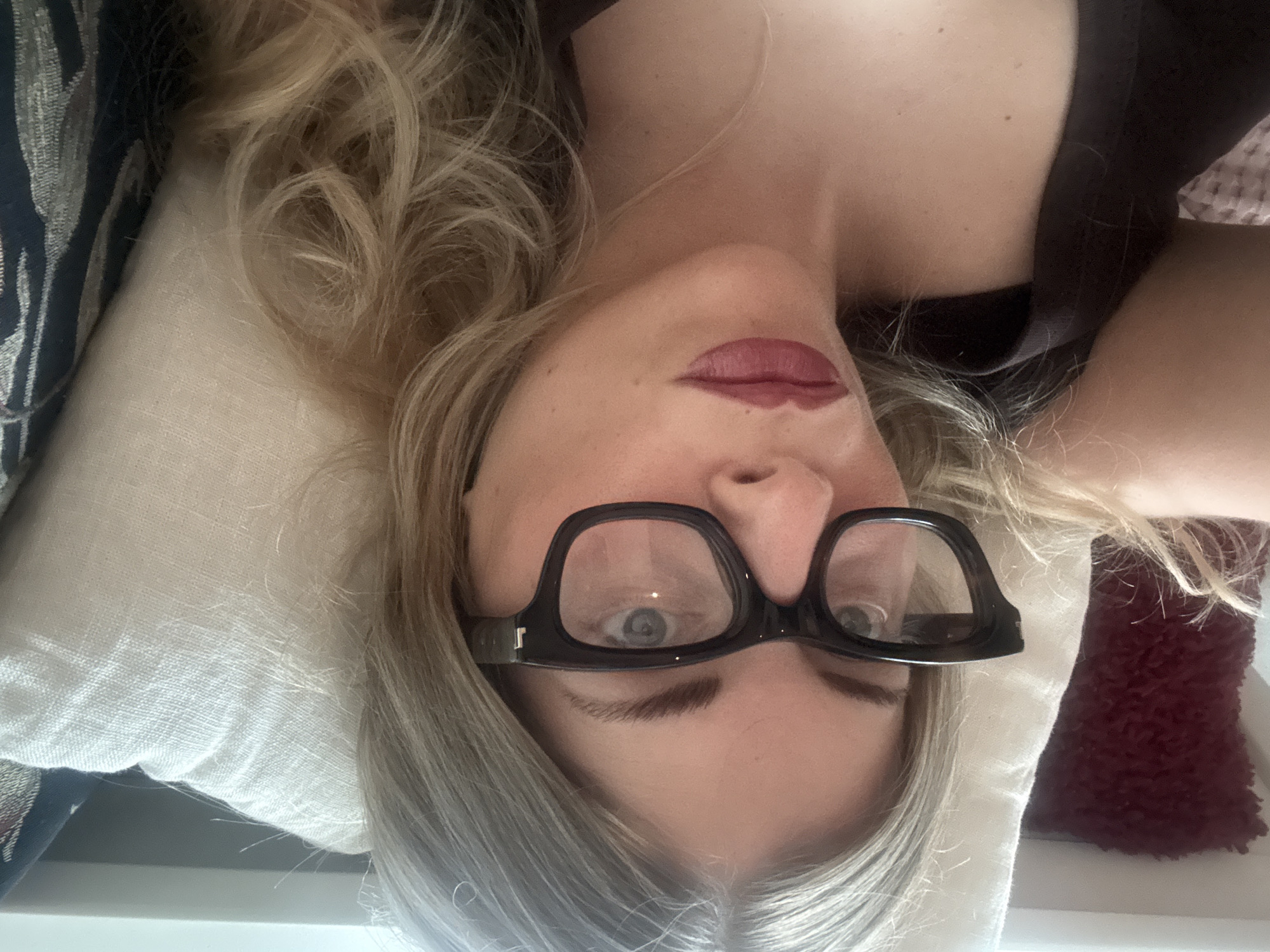 Woman rests indoors in Paris apartment setting
