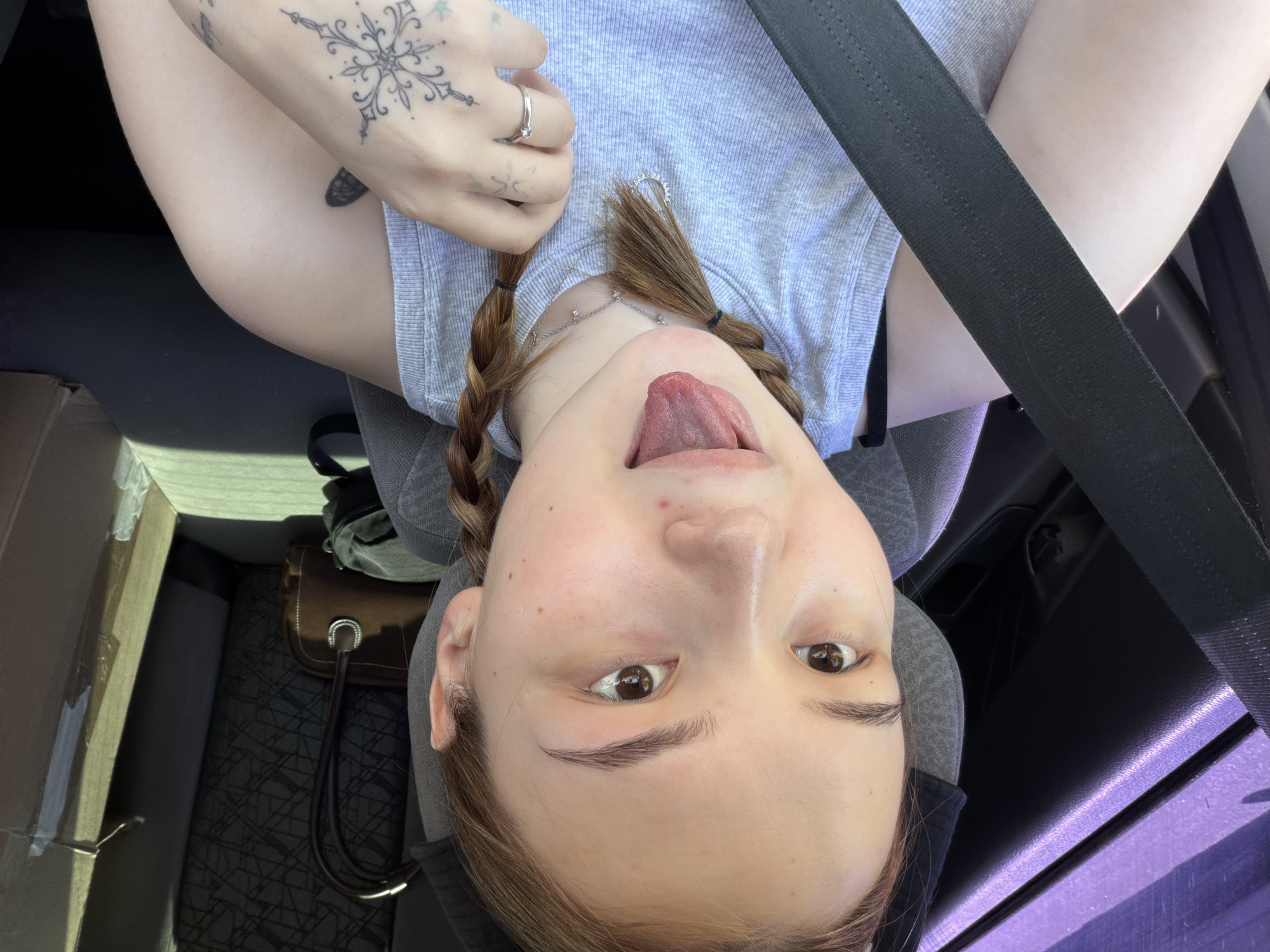 Woman takes car selfies during morning drive in Chaikovsky