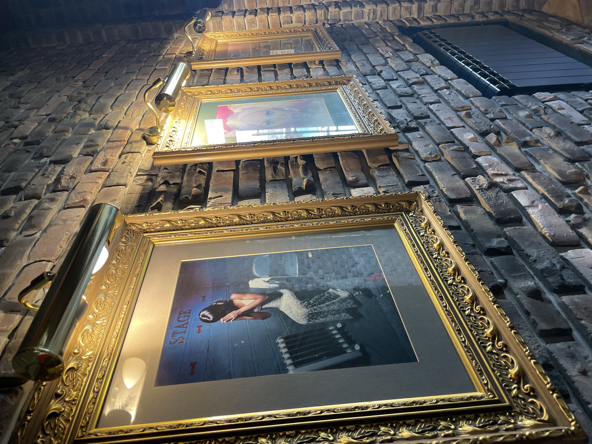Woman visits cafe in Krasnoyarsk, takes selfie near artwork
