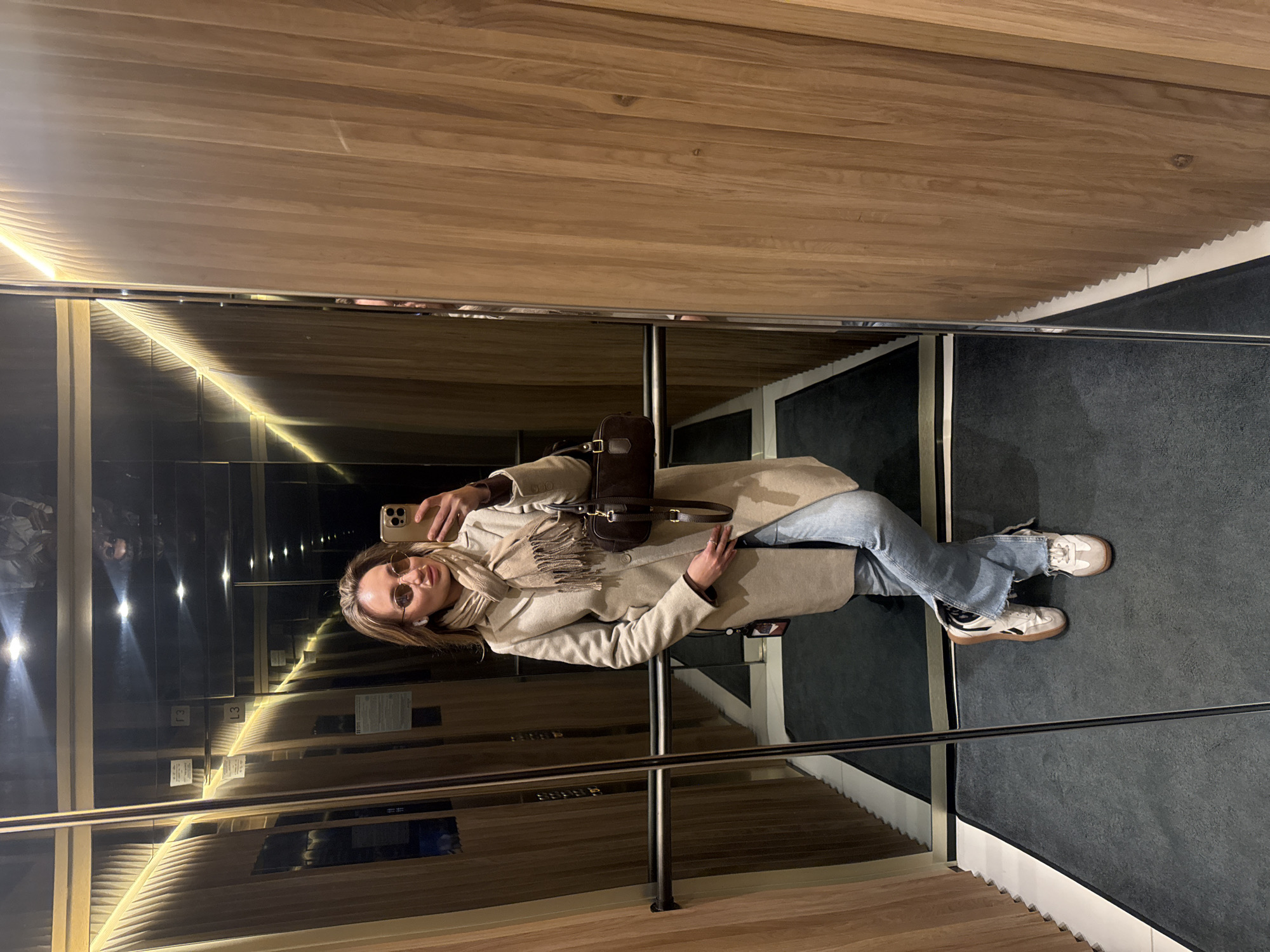 Woman takes elevator selfie in Riga, Latvia