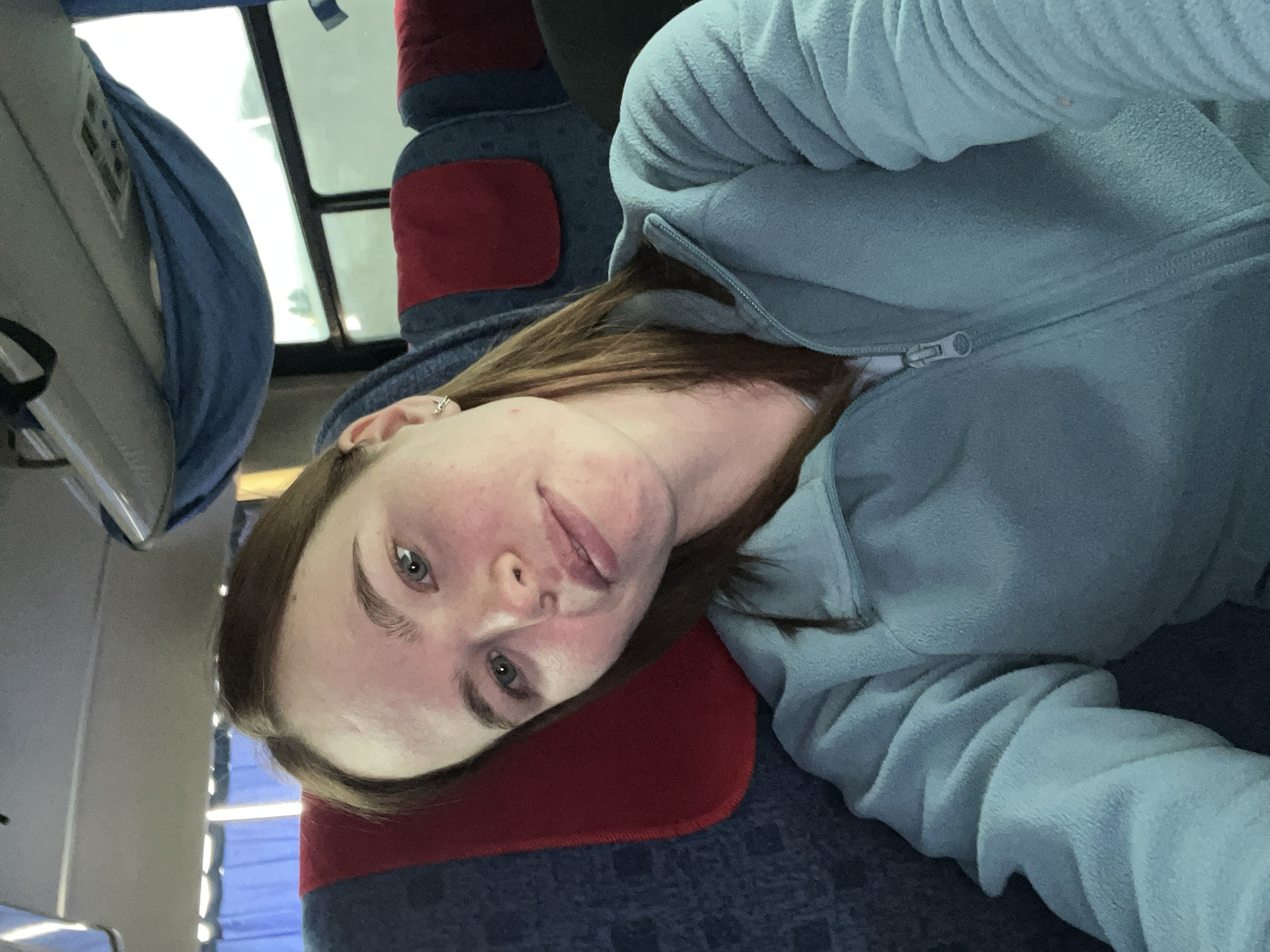 Woman rests on public transport in Bizyar, Russia