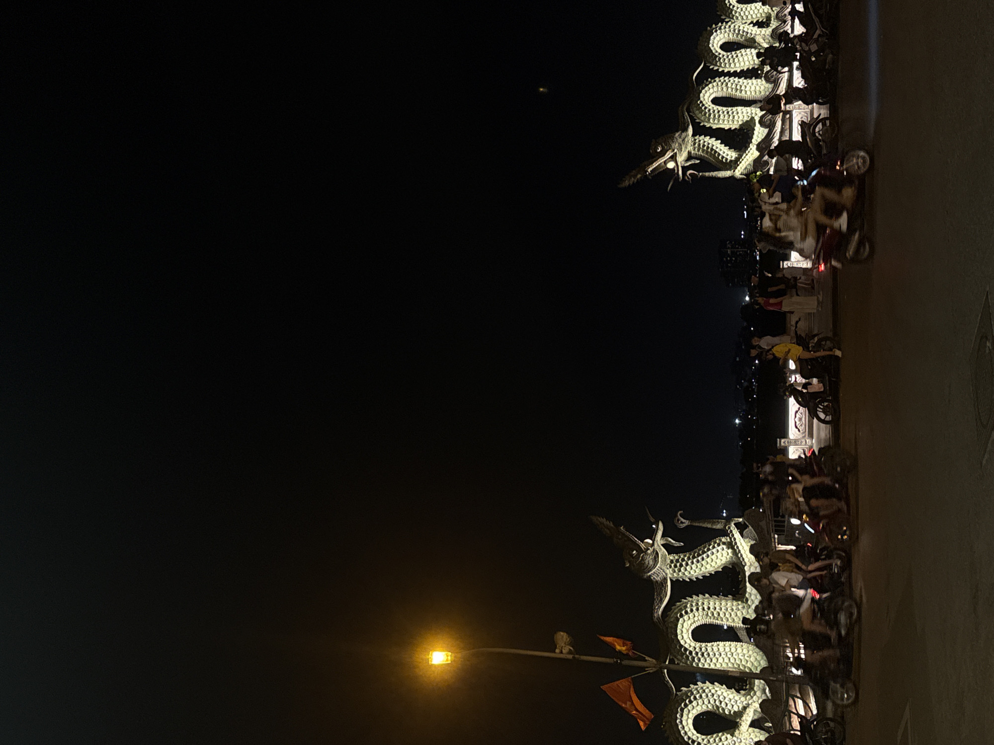 Dragon sculptures spotted on Hà Nội bridge at night