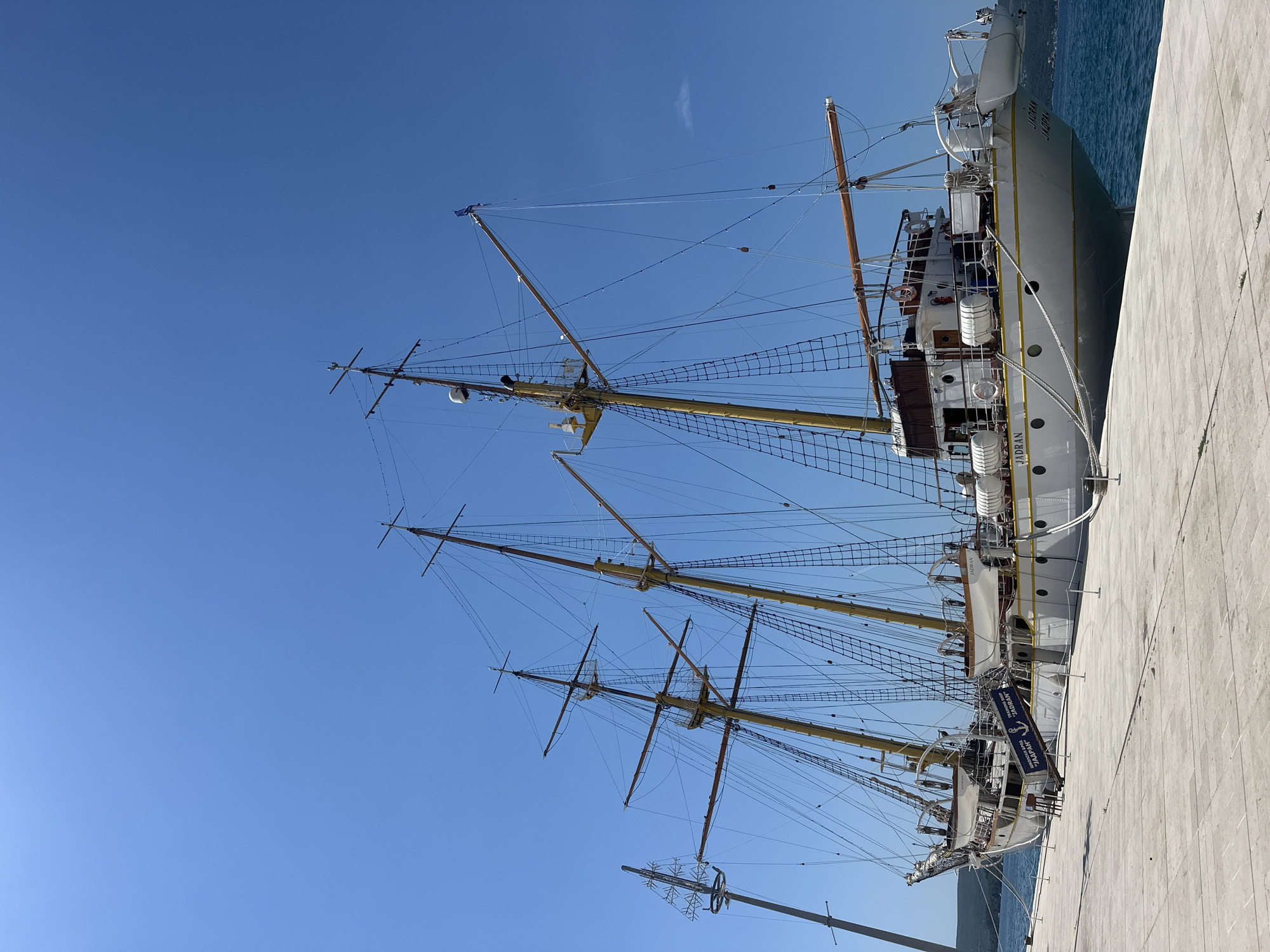 Morning at Donja Lastva's waterfront with the tall ship Jadran