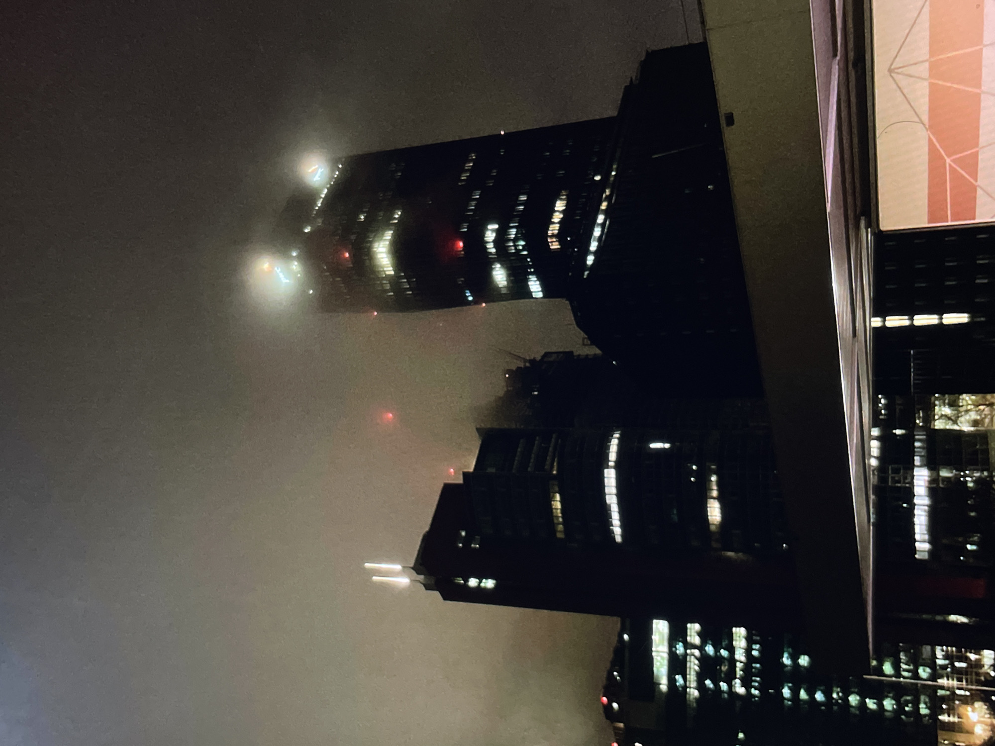 Nighttime urban commute through foggy city streets captured