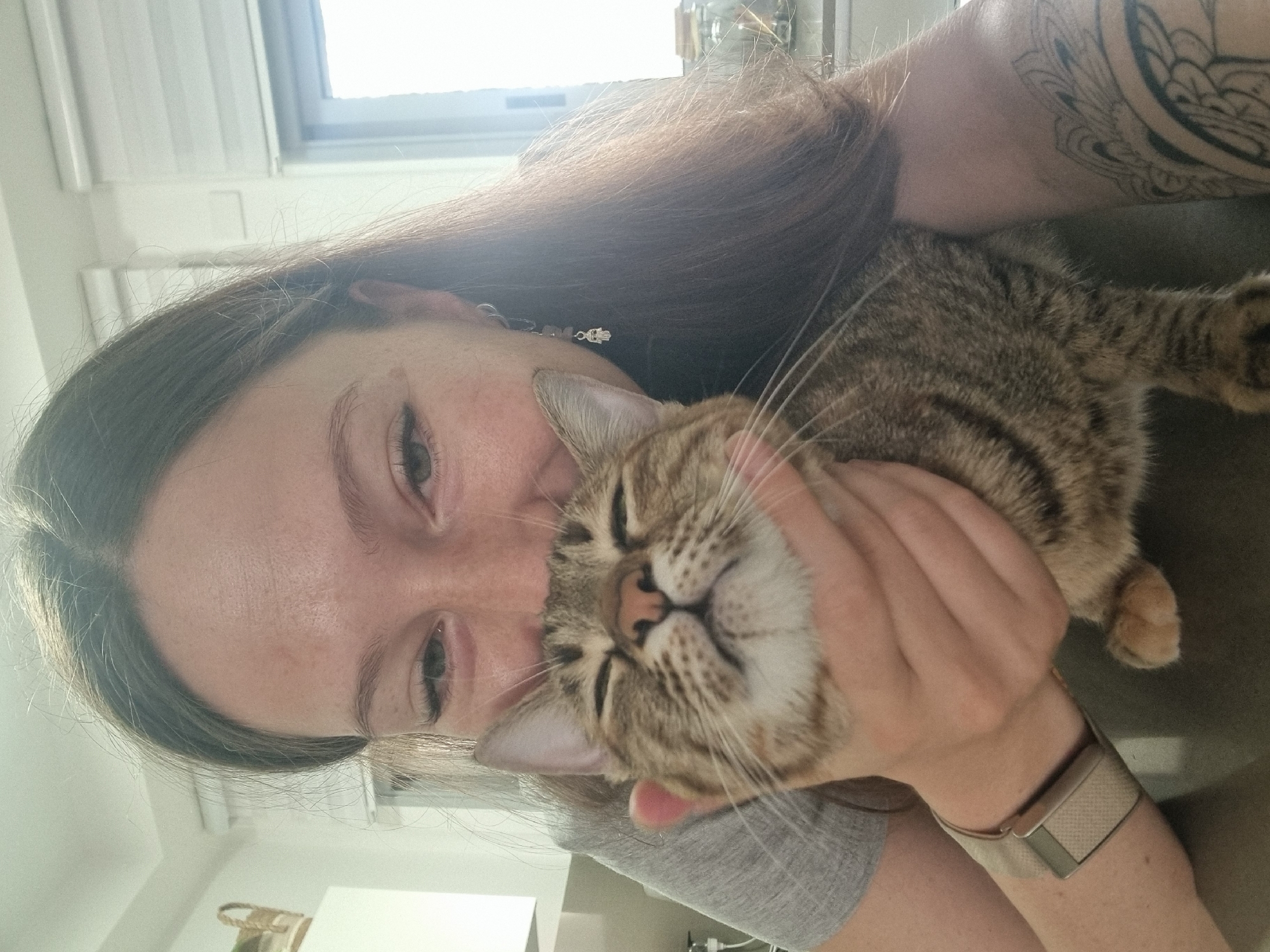 Woman shares affectionate moment with tabby cat in Ramat Gan