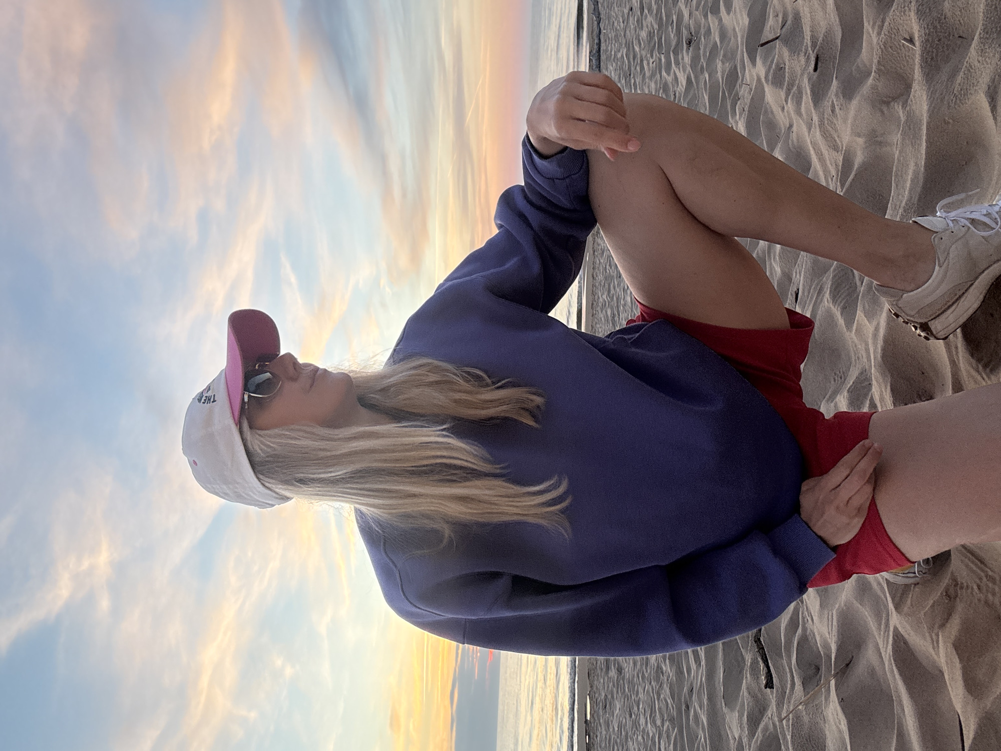 Woman enjoys sunset moment on Riga beach