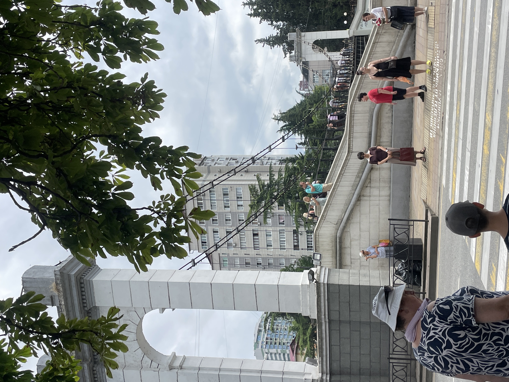 Sunny morning stroll along Sochi's riverside promenade