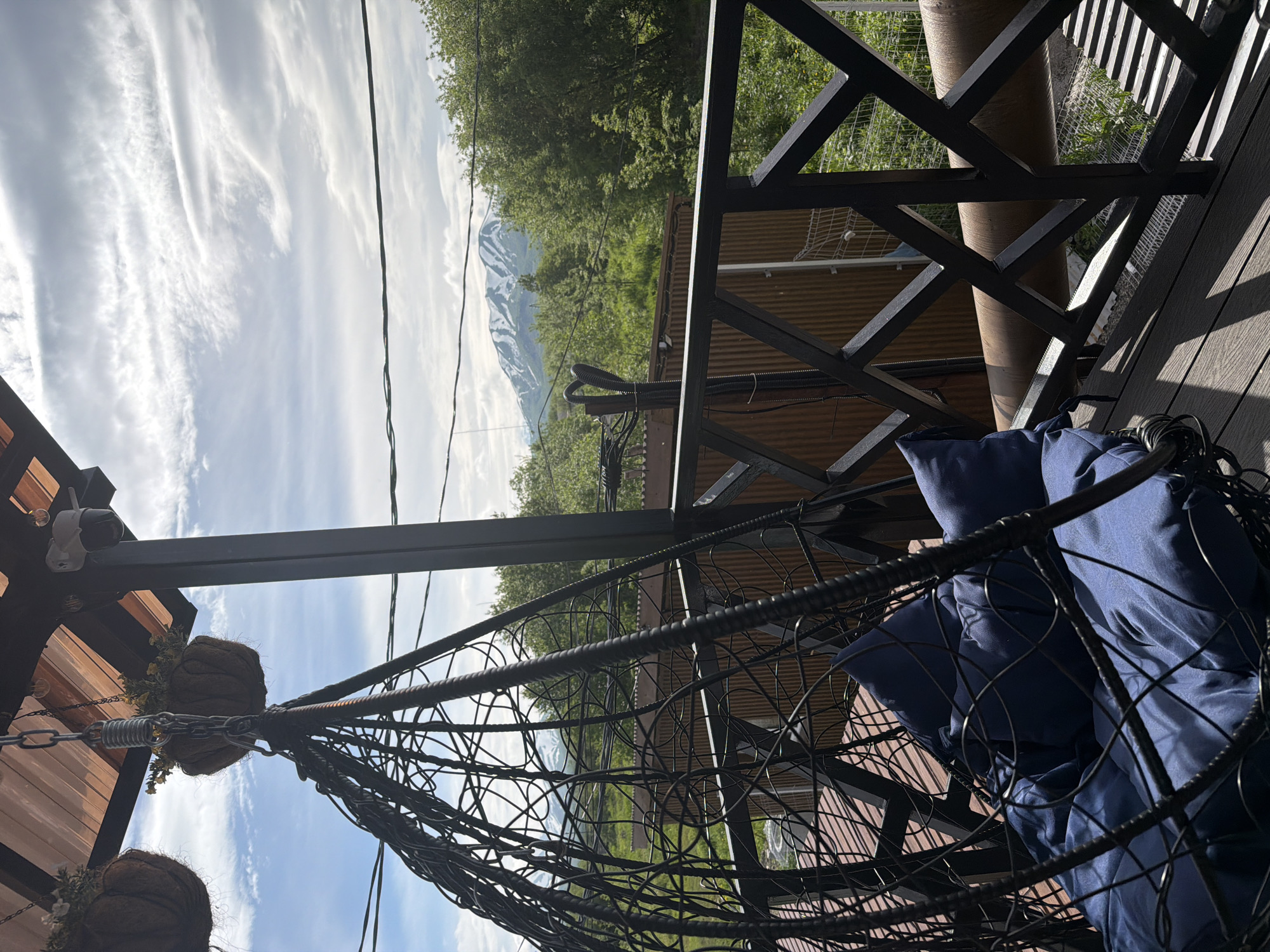 Afternoon at a cozy Sokoch terrace, mountains in the background