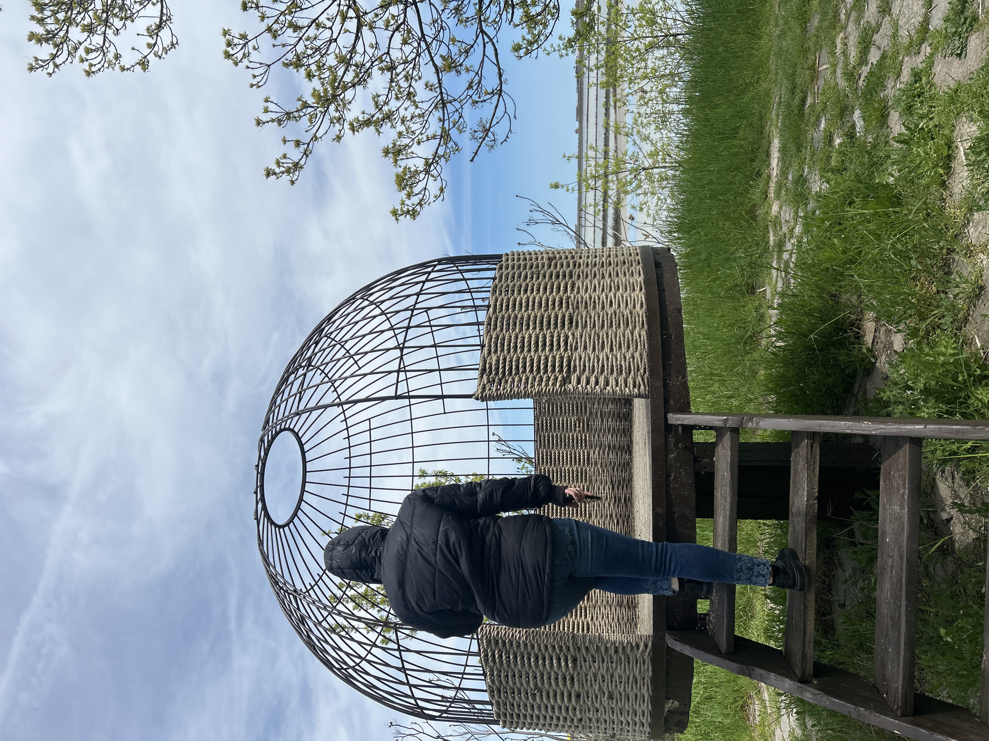 Visitor documents spherical art installation at Burgas waterfront