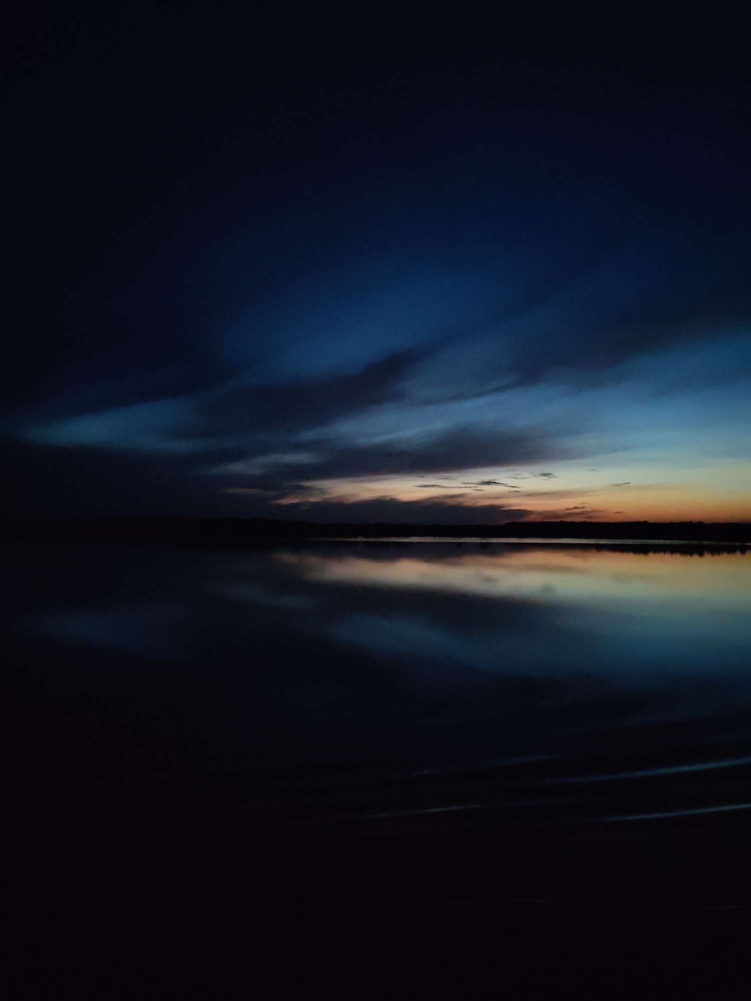 Twilight observed over water in Korcheva, Russia