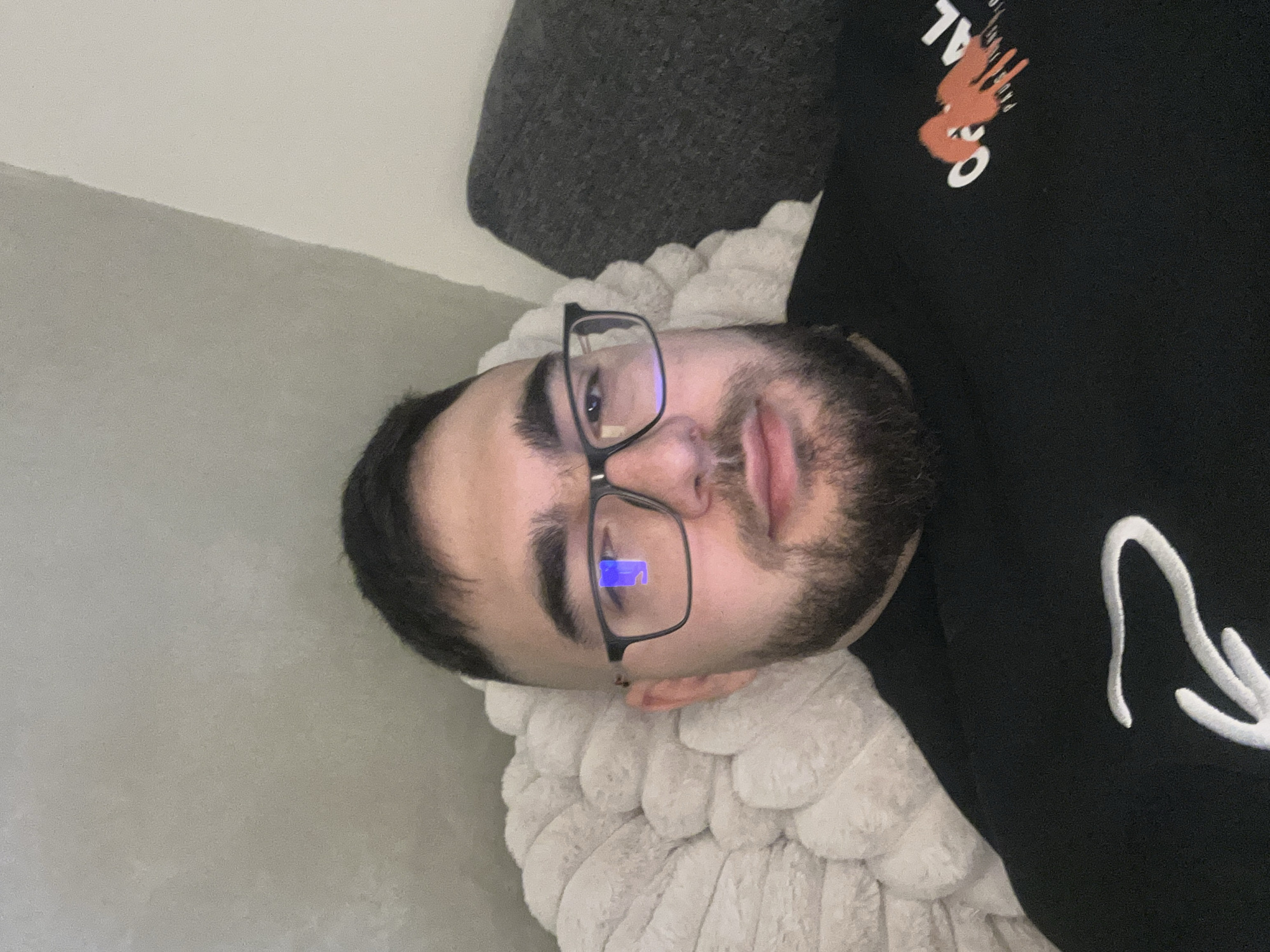 Person studies medical content on tablet while resting