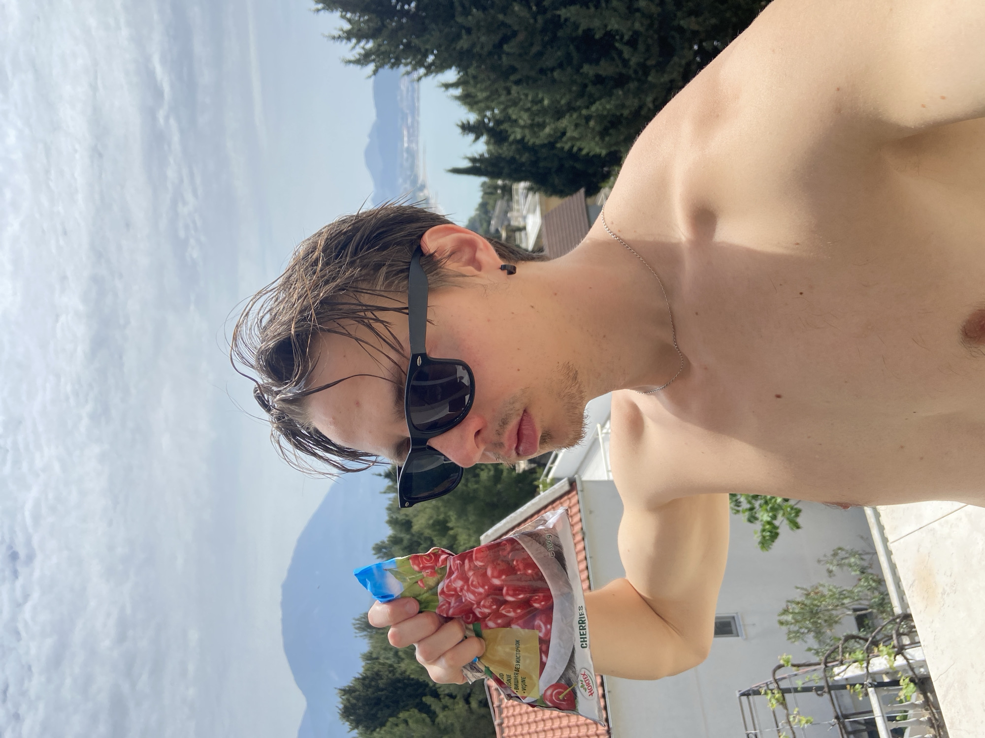 Man enjoys morning snack on balcony in coastal Montenegro