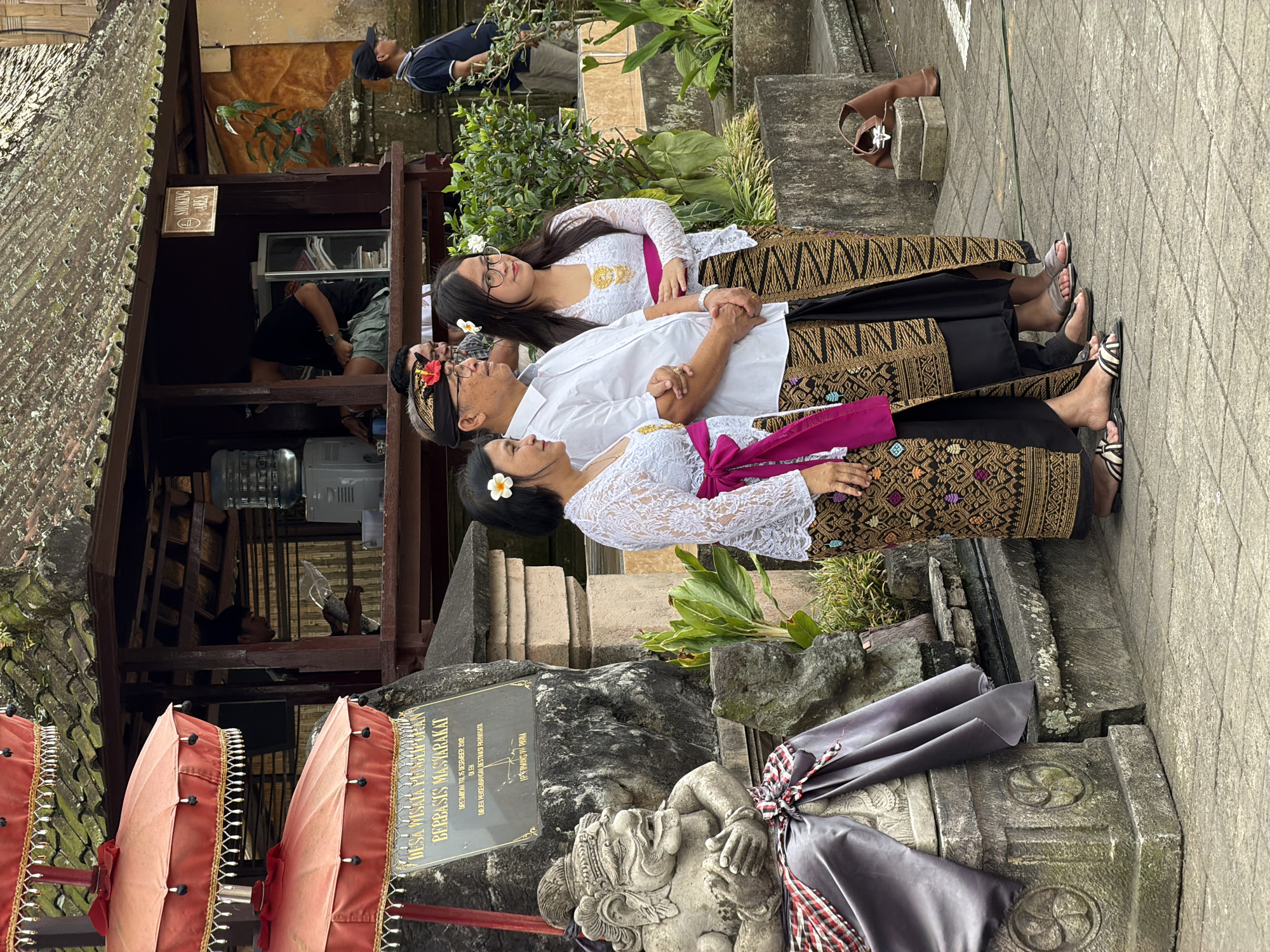 Traditional dress and a sleeping dog in Bangli, Bali