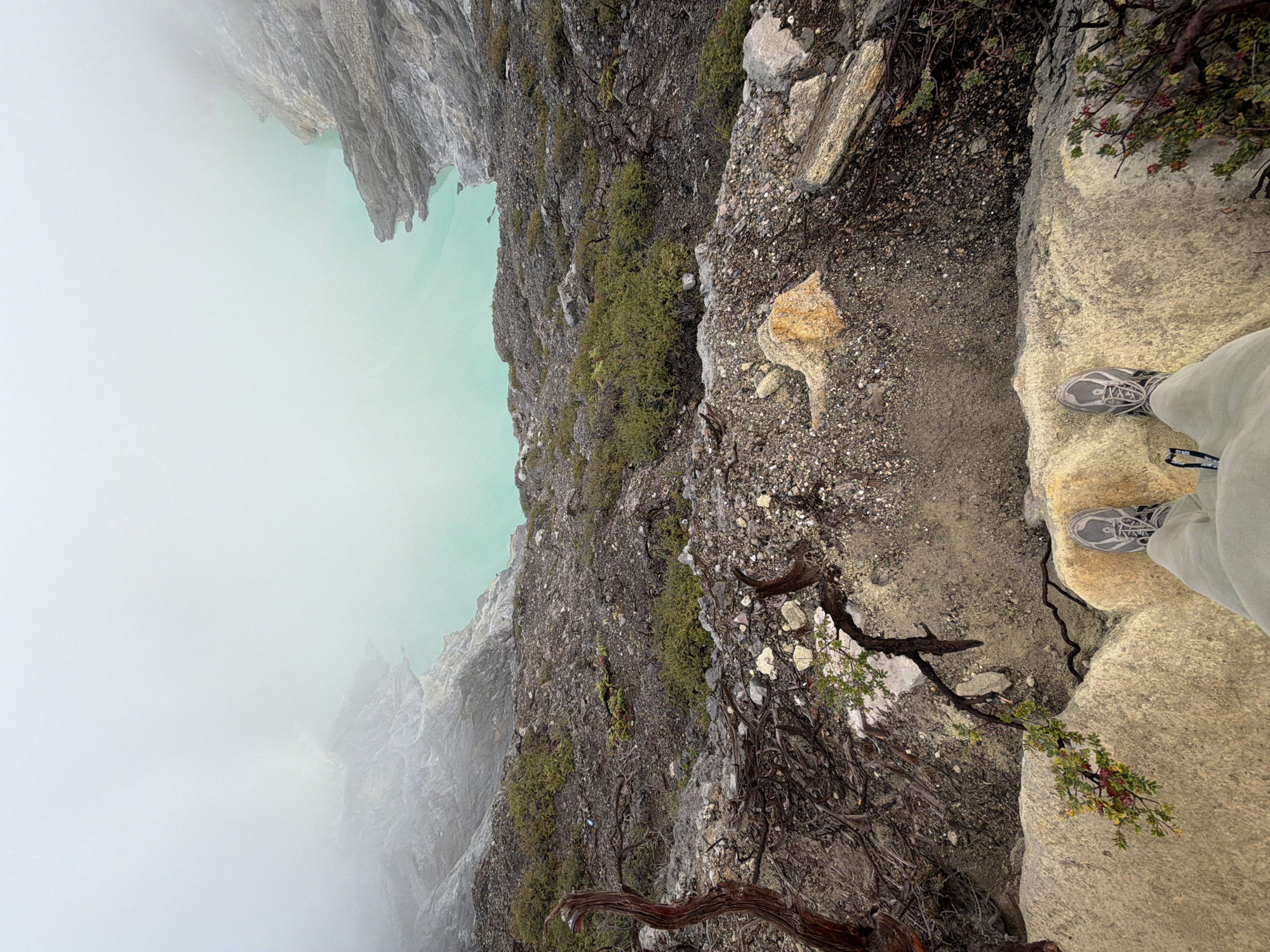 Crater rim visit at golden hour, turquoise lake and campfires below