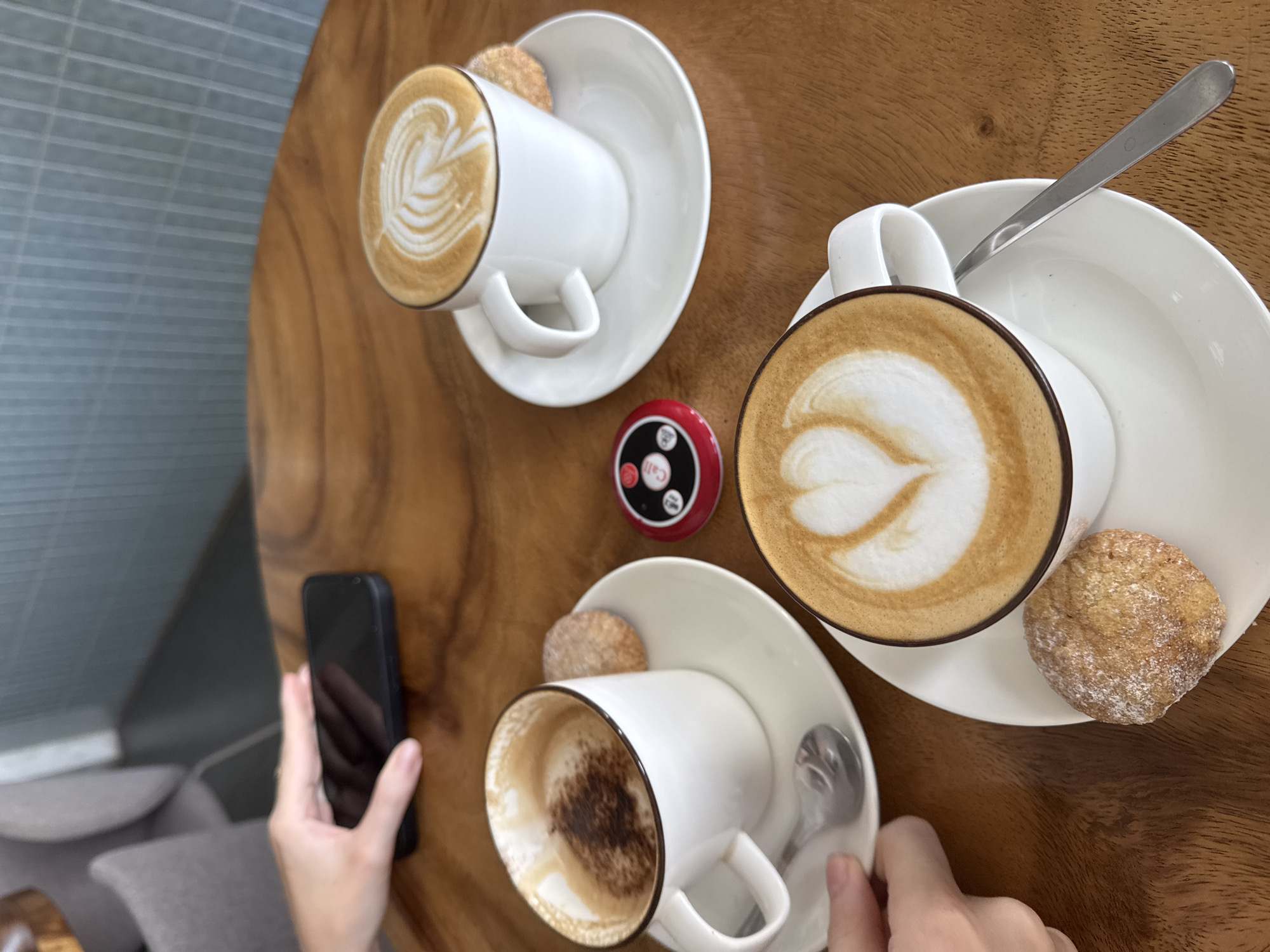 Early morning cafe scene with latte art captured