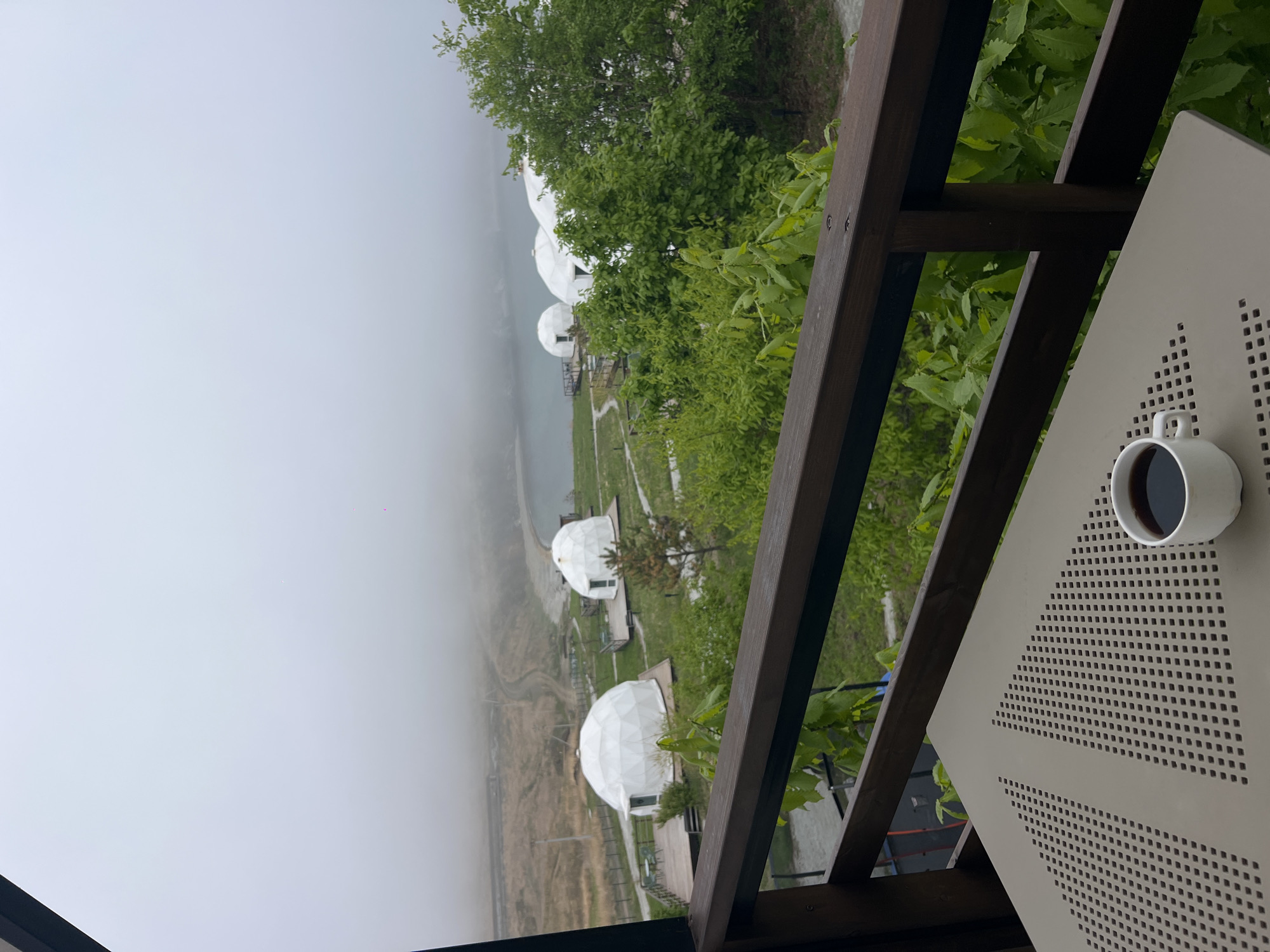 Morning balcony view captures domed structures in Zarubino, Russia