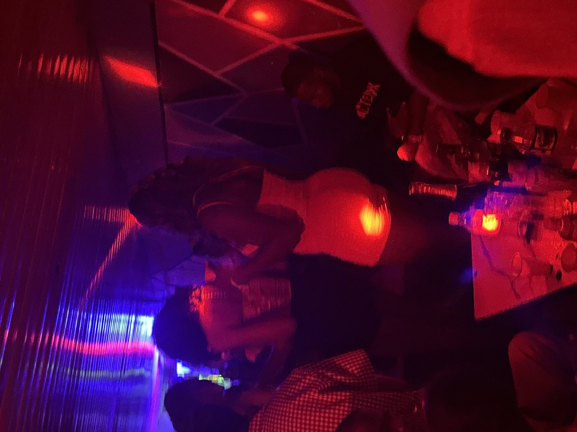 Night out at a Nigerian club, blue lights and dancing