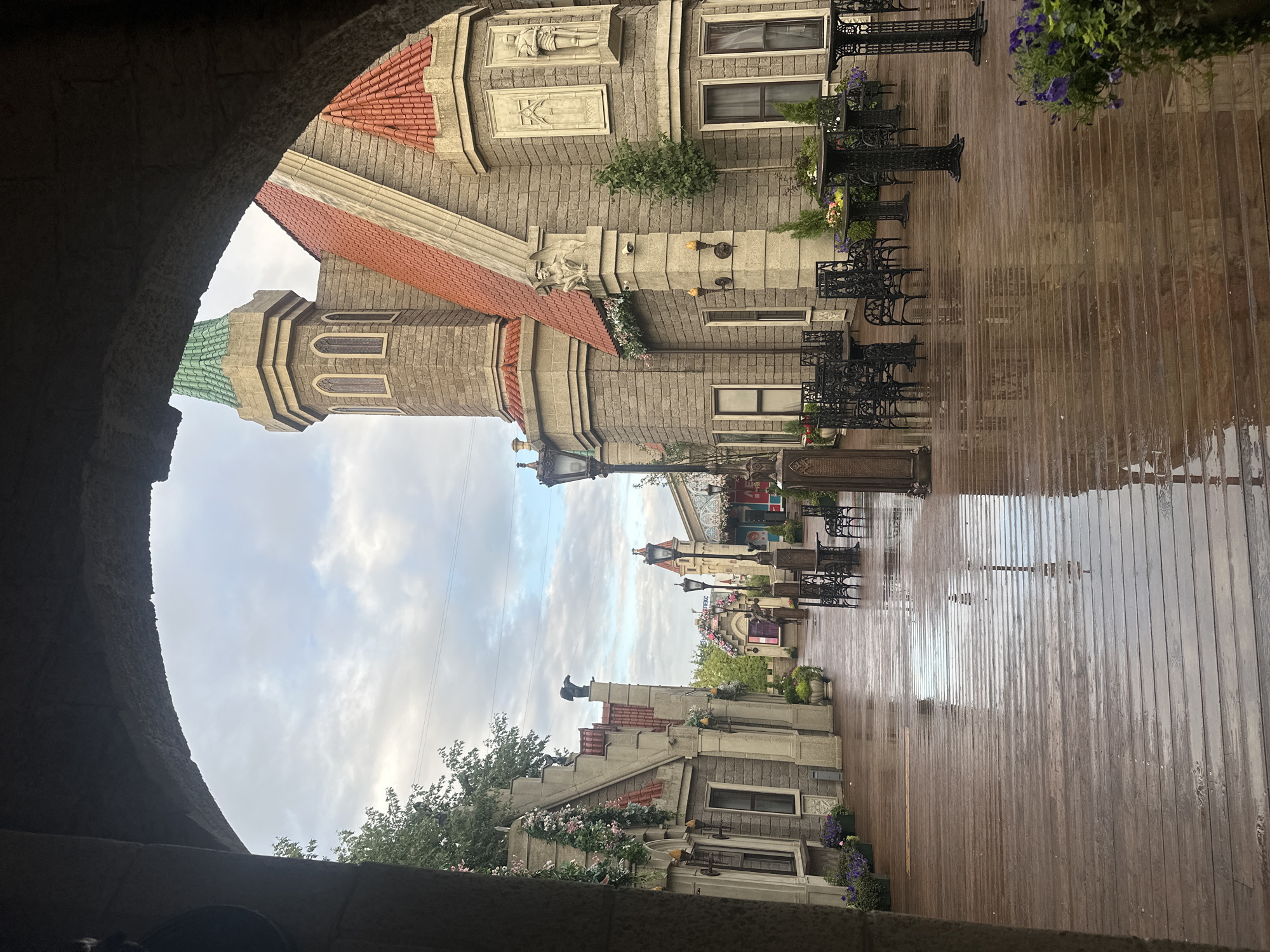 Rainy afternoon in a Moscow fairytale courtyard, flowers in bloom