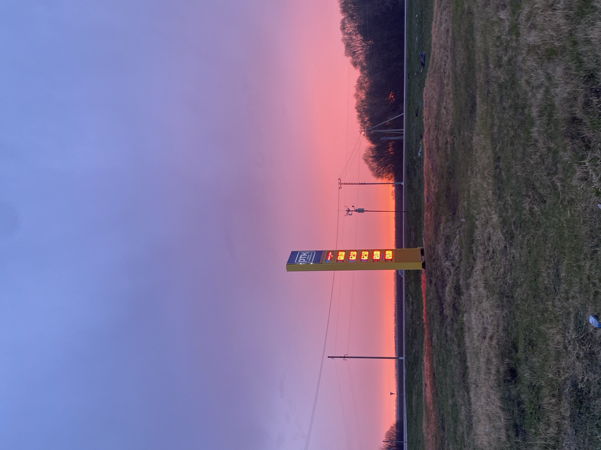 PTK gas station captured during colorful sunset in Russia
