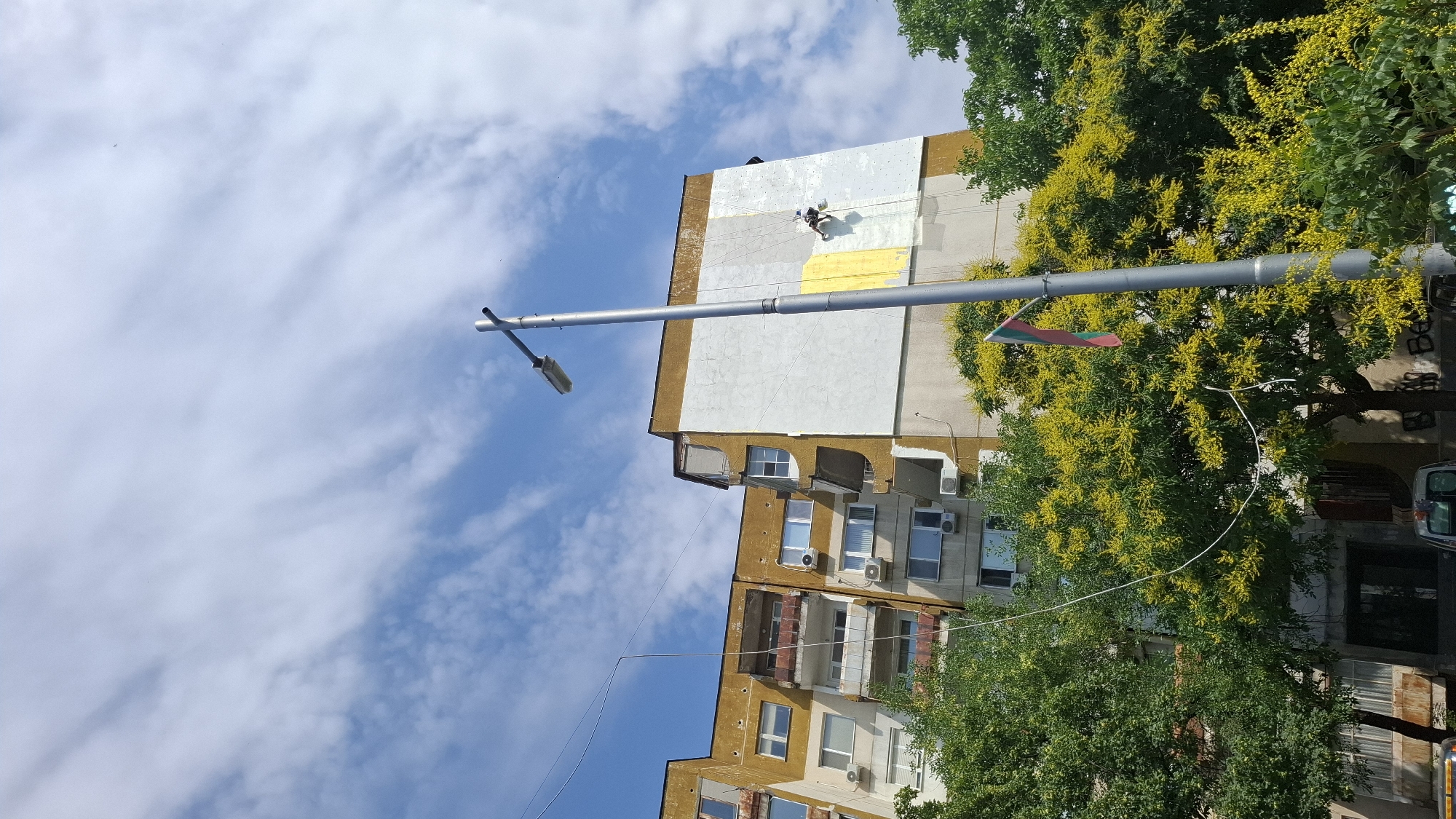 Sunny morning on a Plovdiv residential street, maintenance work underway