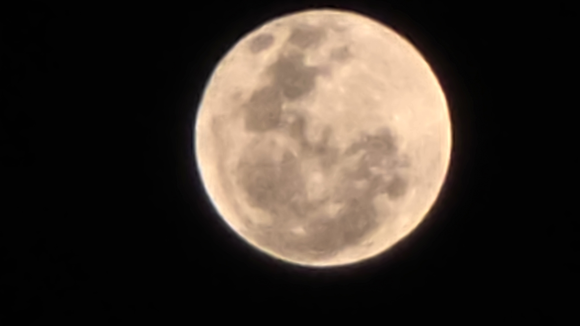 Full moon rises over Yerevan's lit-up nightscape