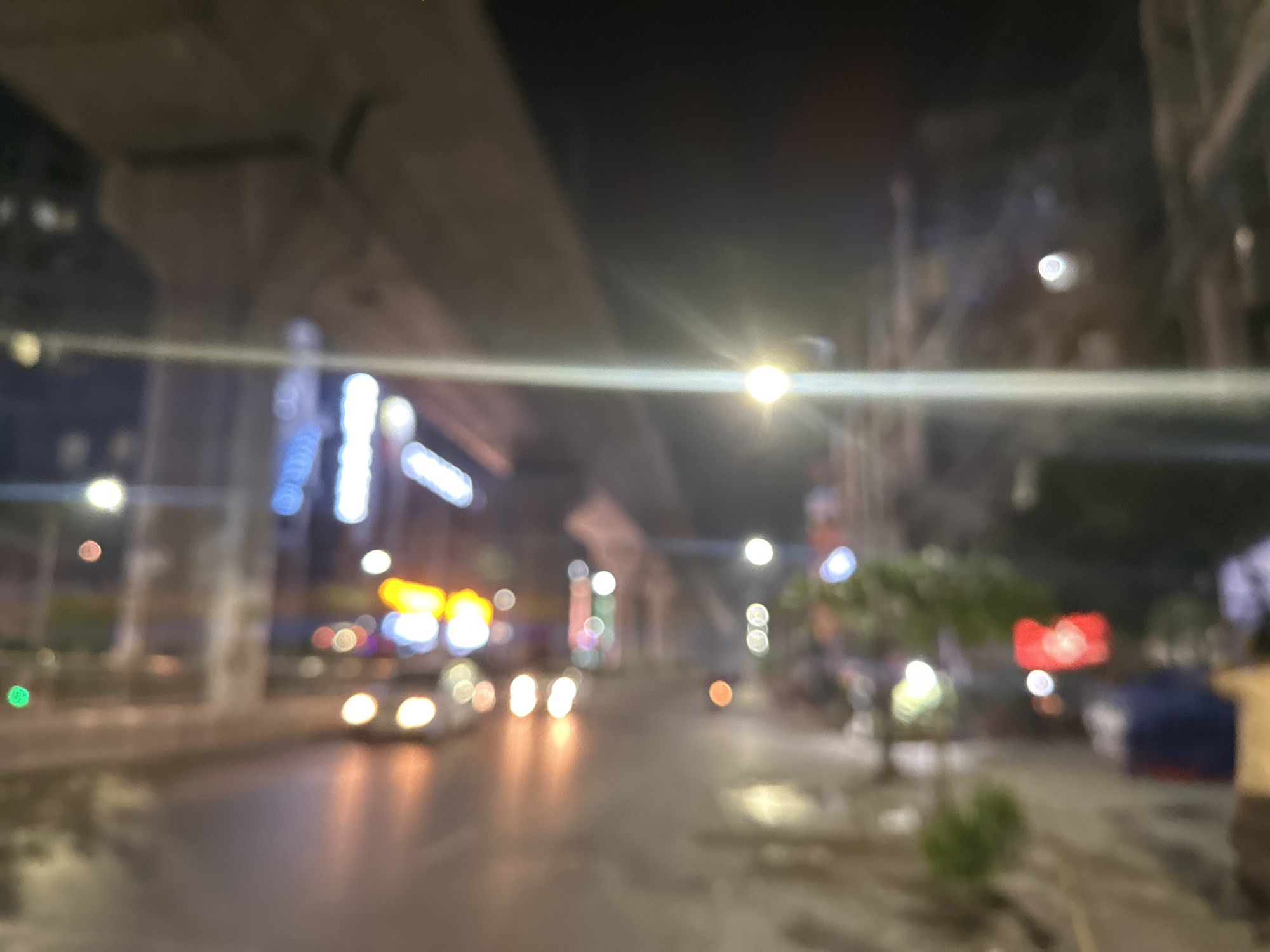 Evening scenes captured in Dhaka: wet streets, restaurant interior