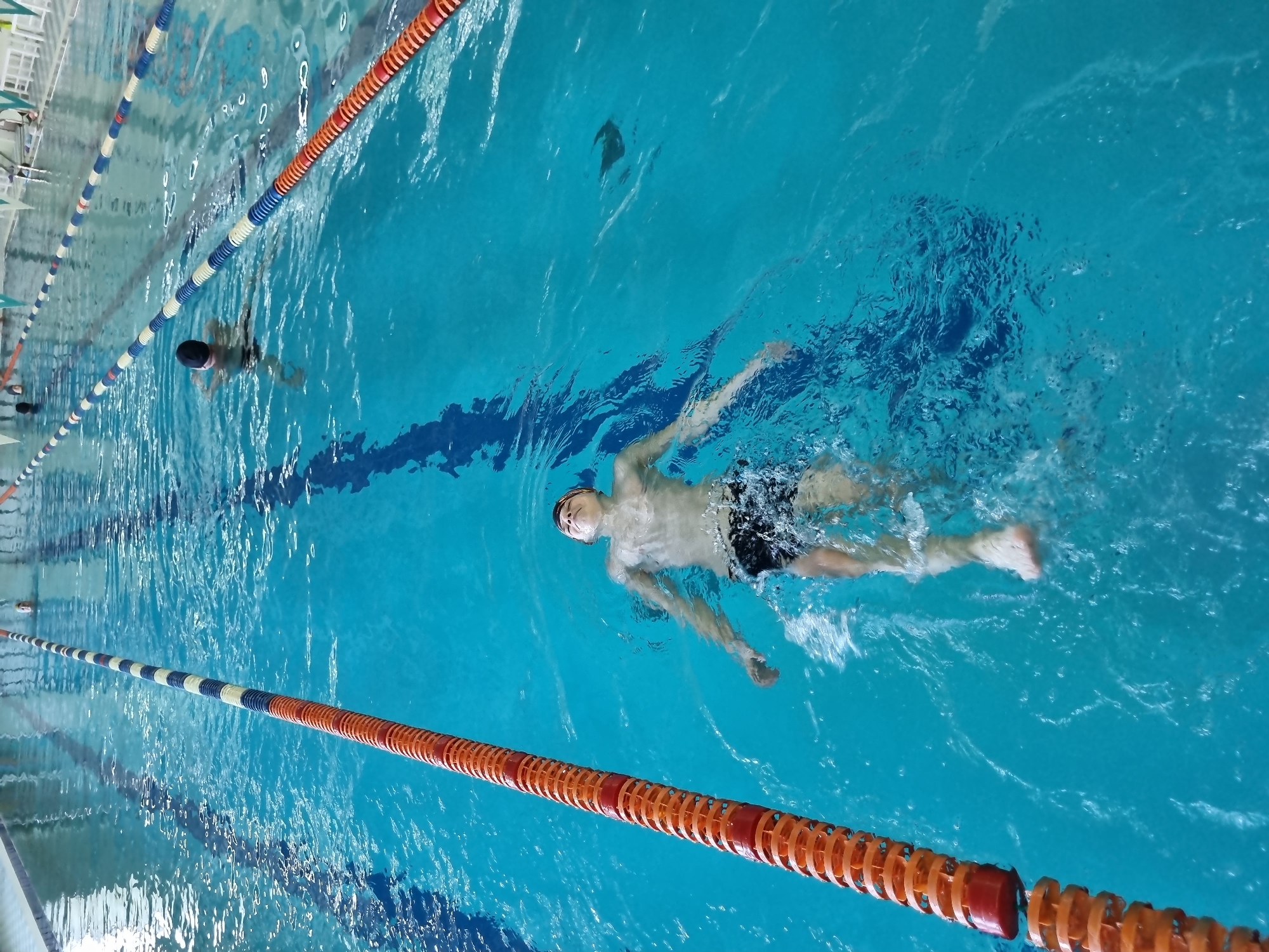 Early morning swimming session at indoor pool facility
