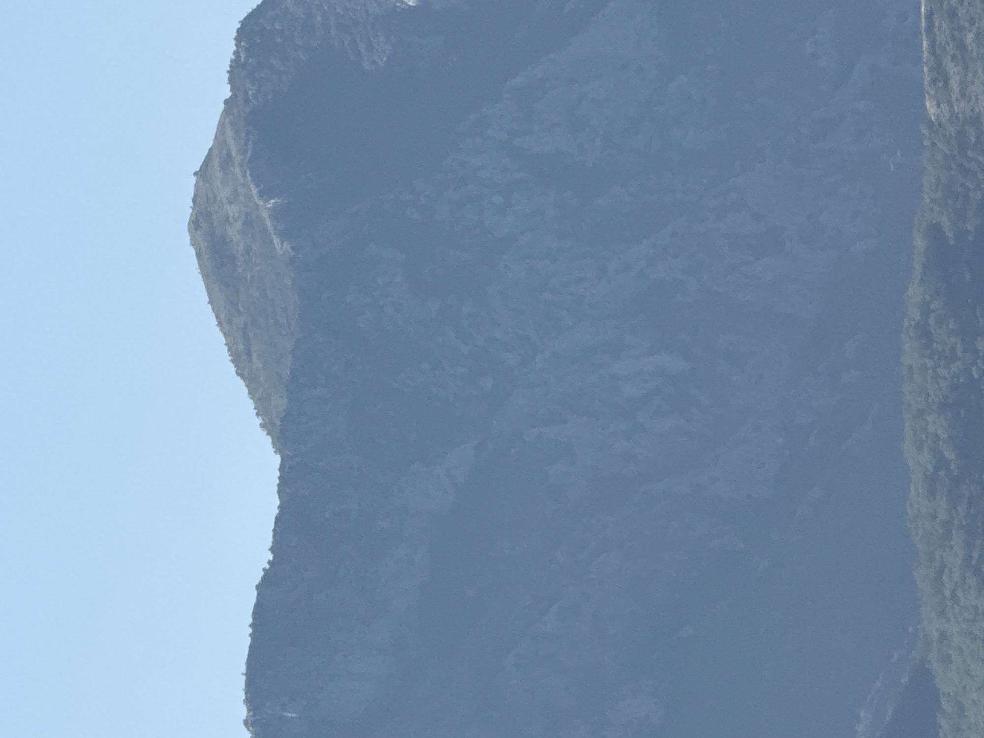 White superyacht anchored off the rocky Montenegrin coastline at Boreti