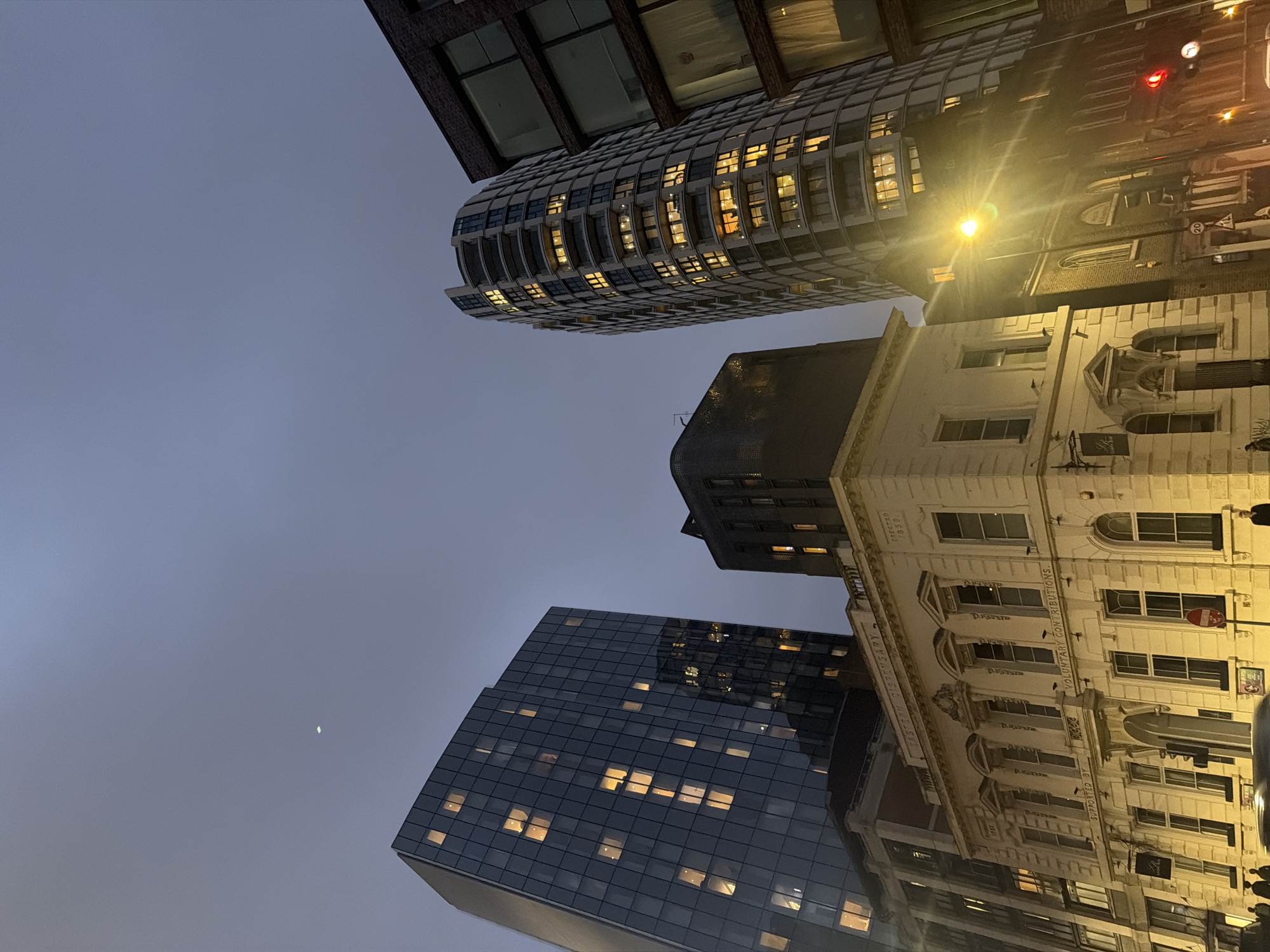 London skyline photographed at dusk, buildings illuminated