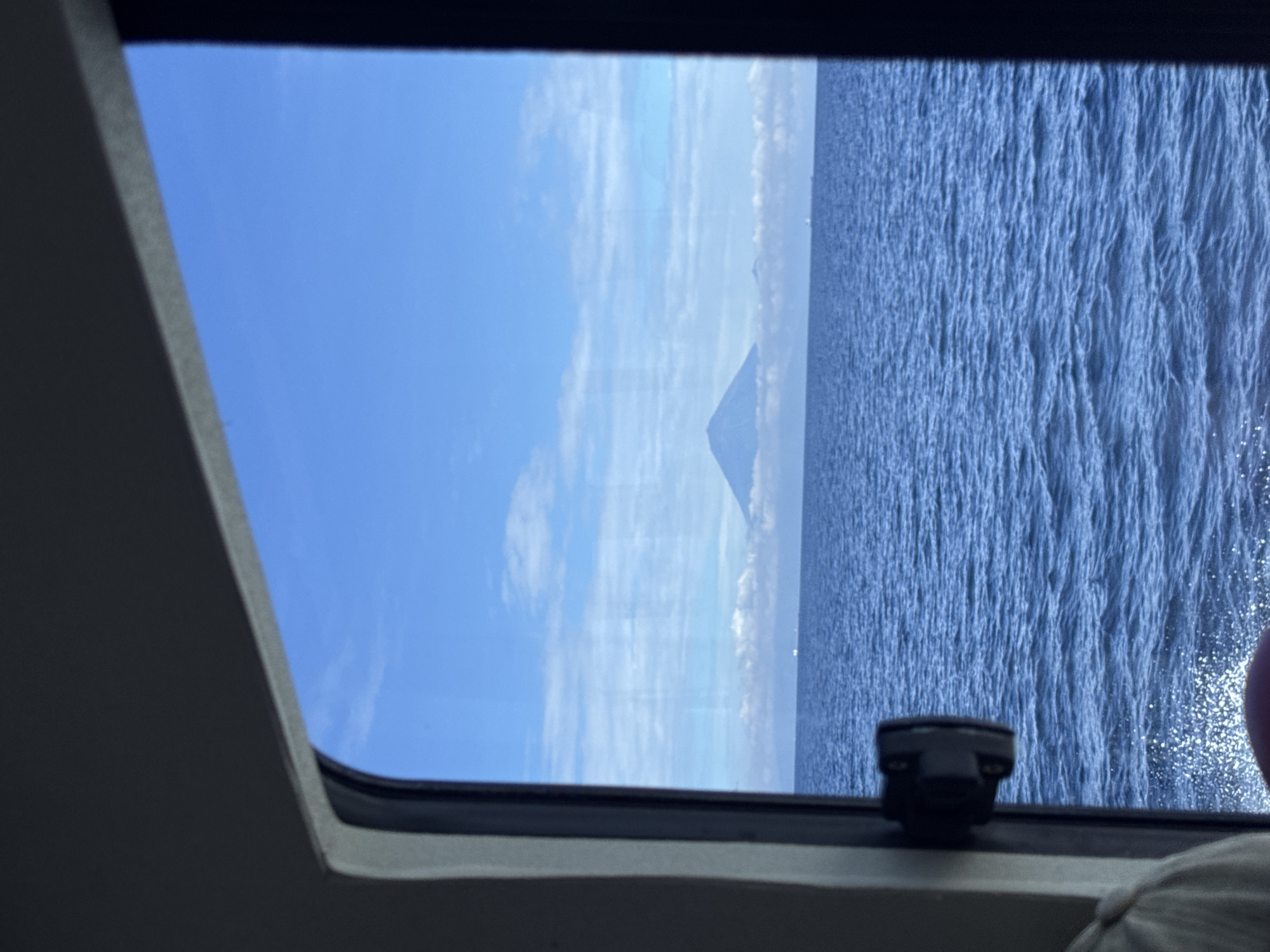 Ocean view captured from boat window in Indonesian waters