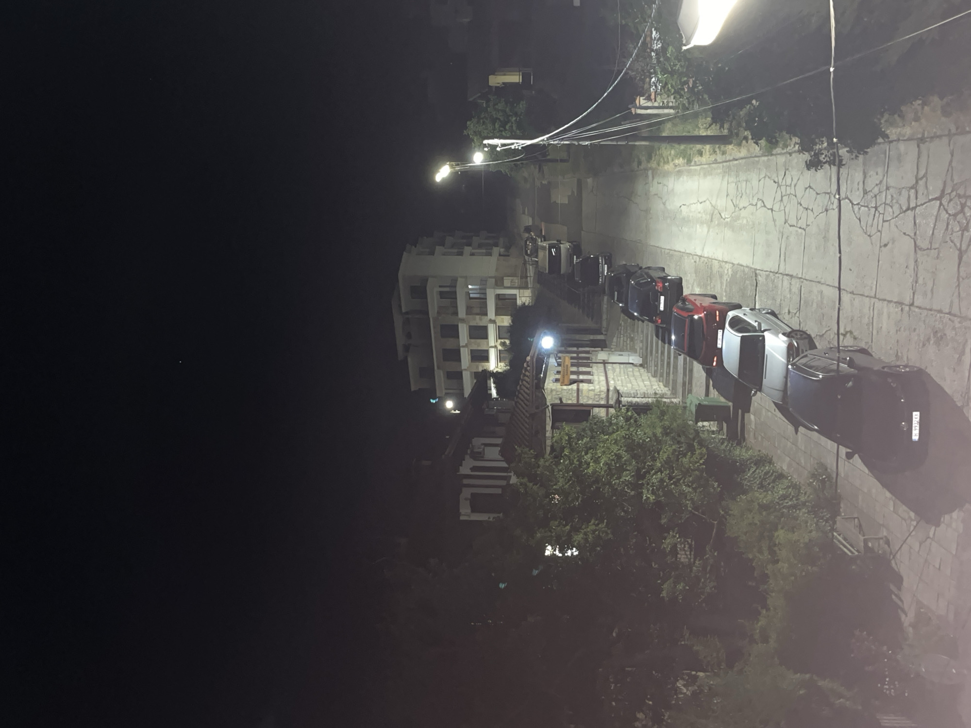 Evening street scenes along a sloped road in Obzor, Bulgaria