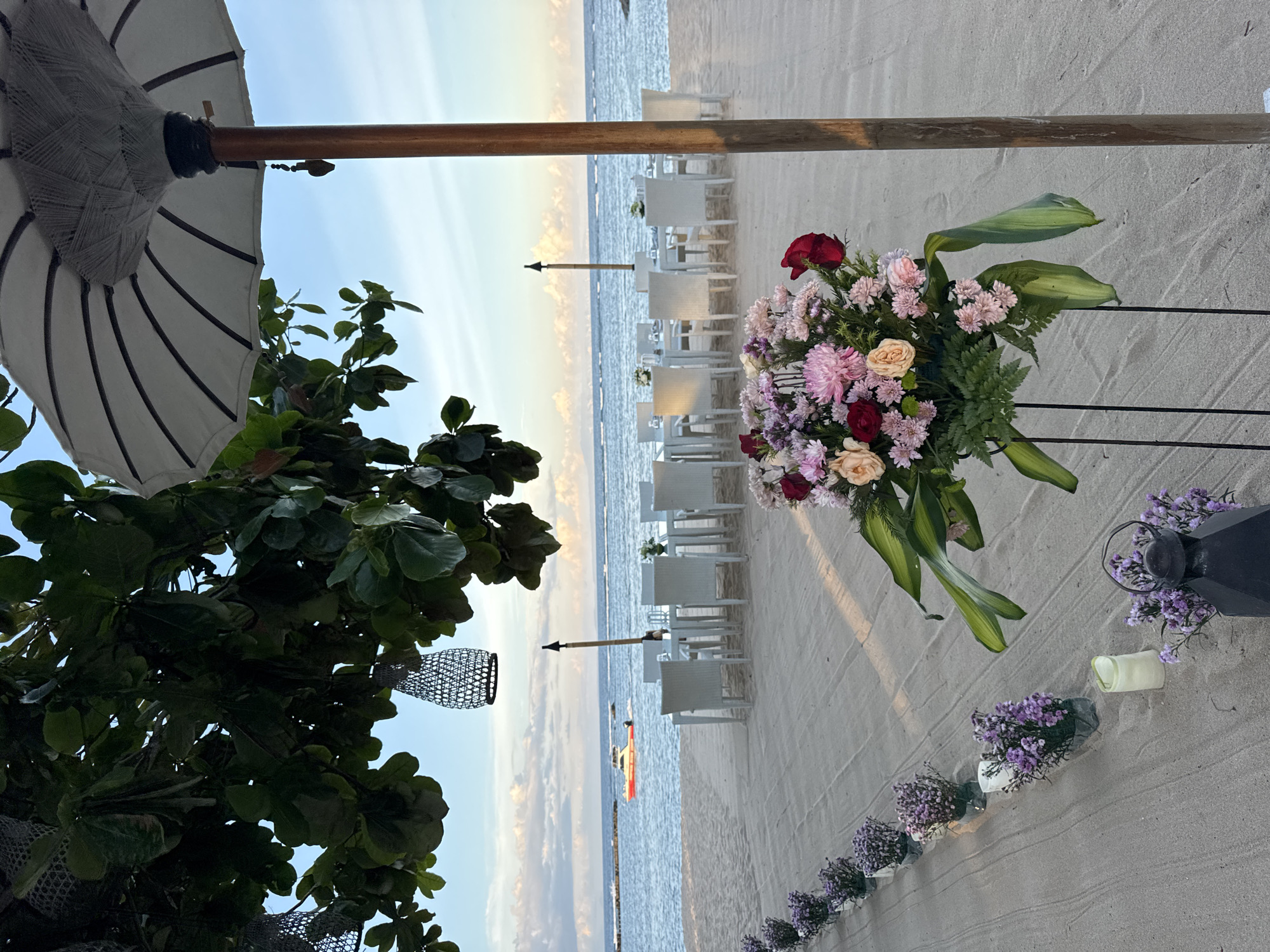 Beach wedding celebration captured at Indonesian coastal venue