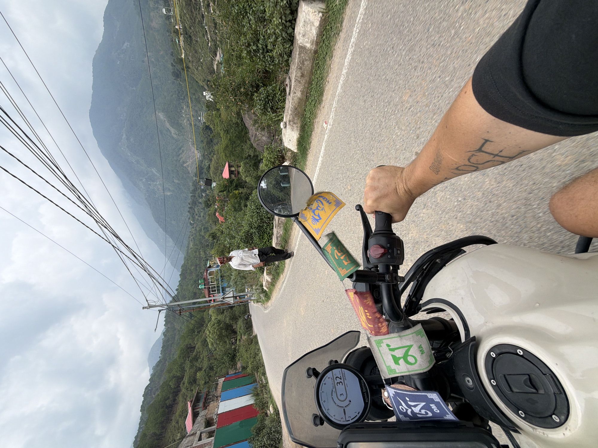 Motorcycle ride through misty Himachal mountain valleys