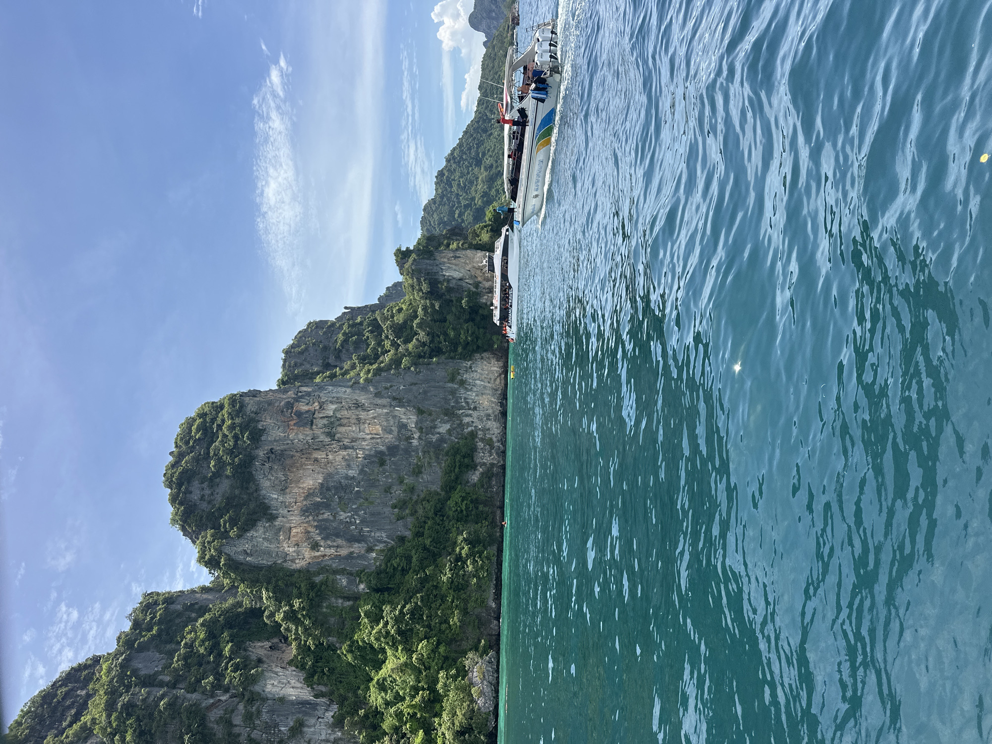 Speedboat moving through limestone island waters near Ao Nang