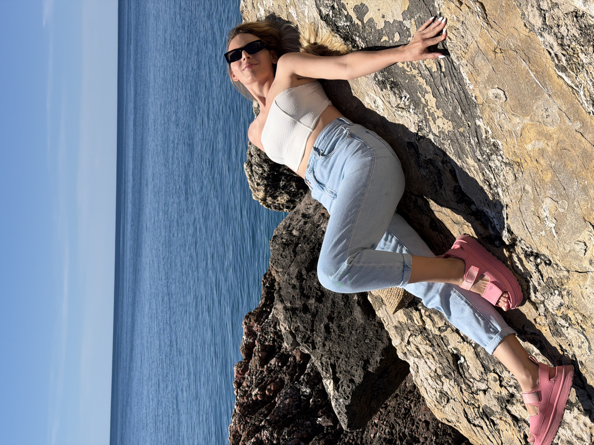 Woman poses for photos along Montenegro coast in Petrovac