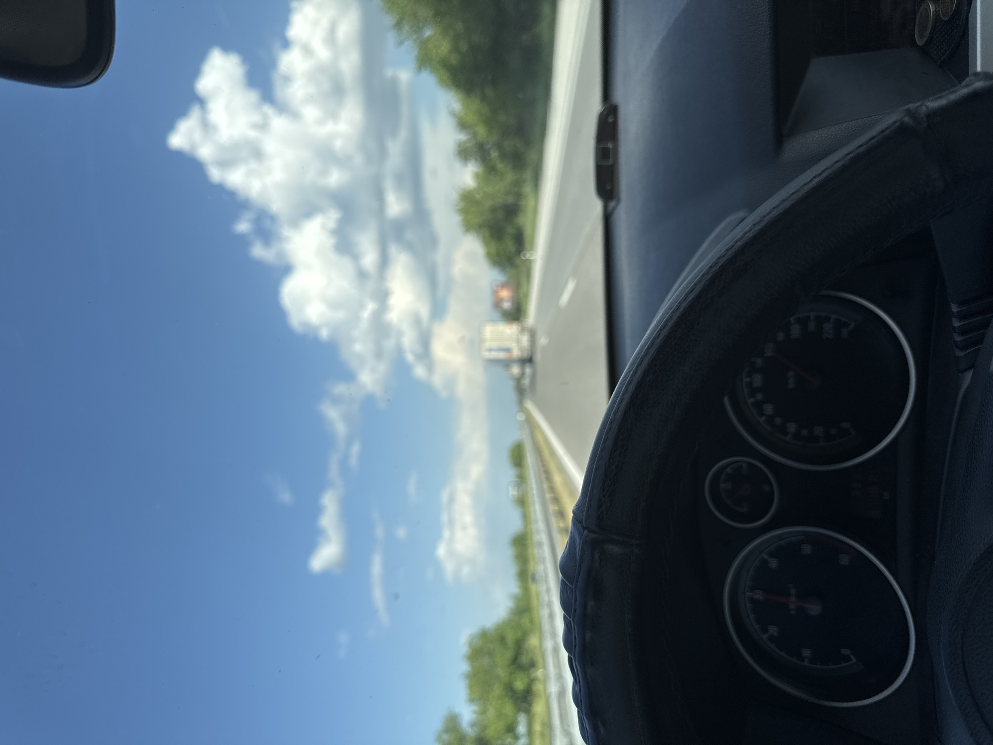 Driver captures highway view under blue skies near Shtarkovo
