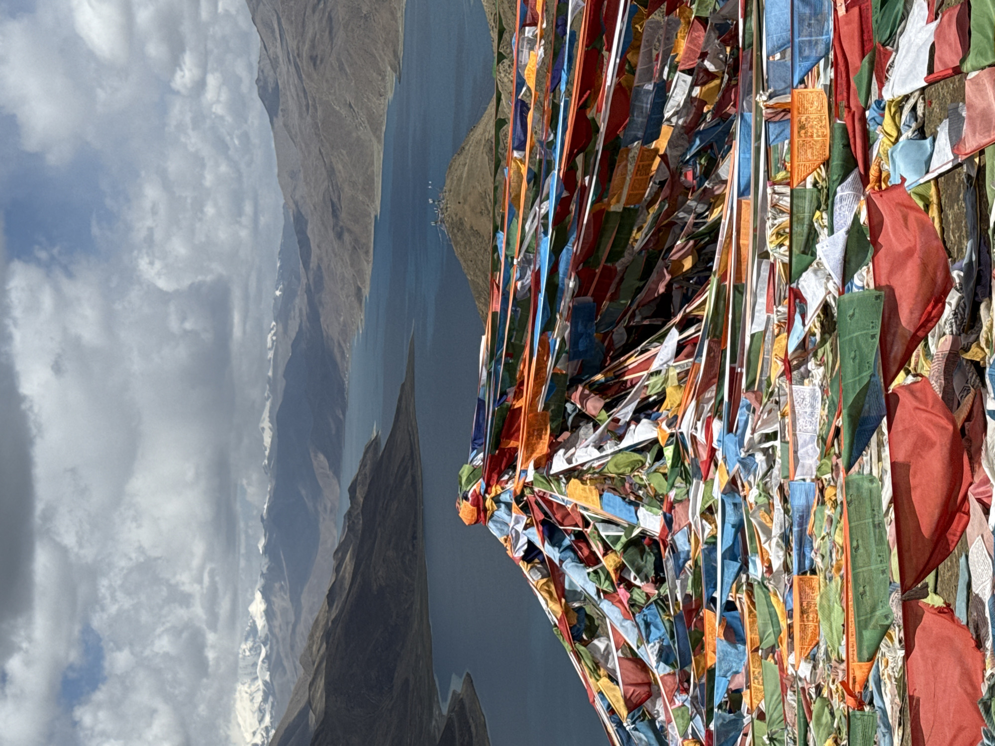 Buddhist prayer flags documented in mountainous Qangtang town landscape